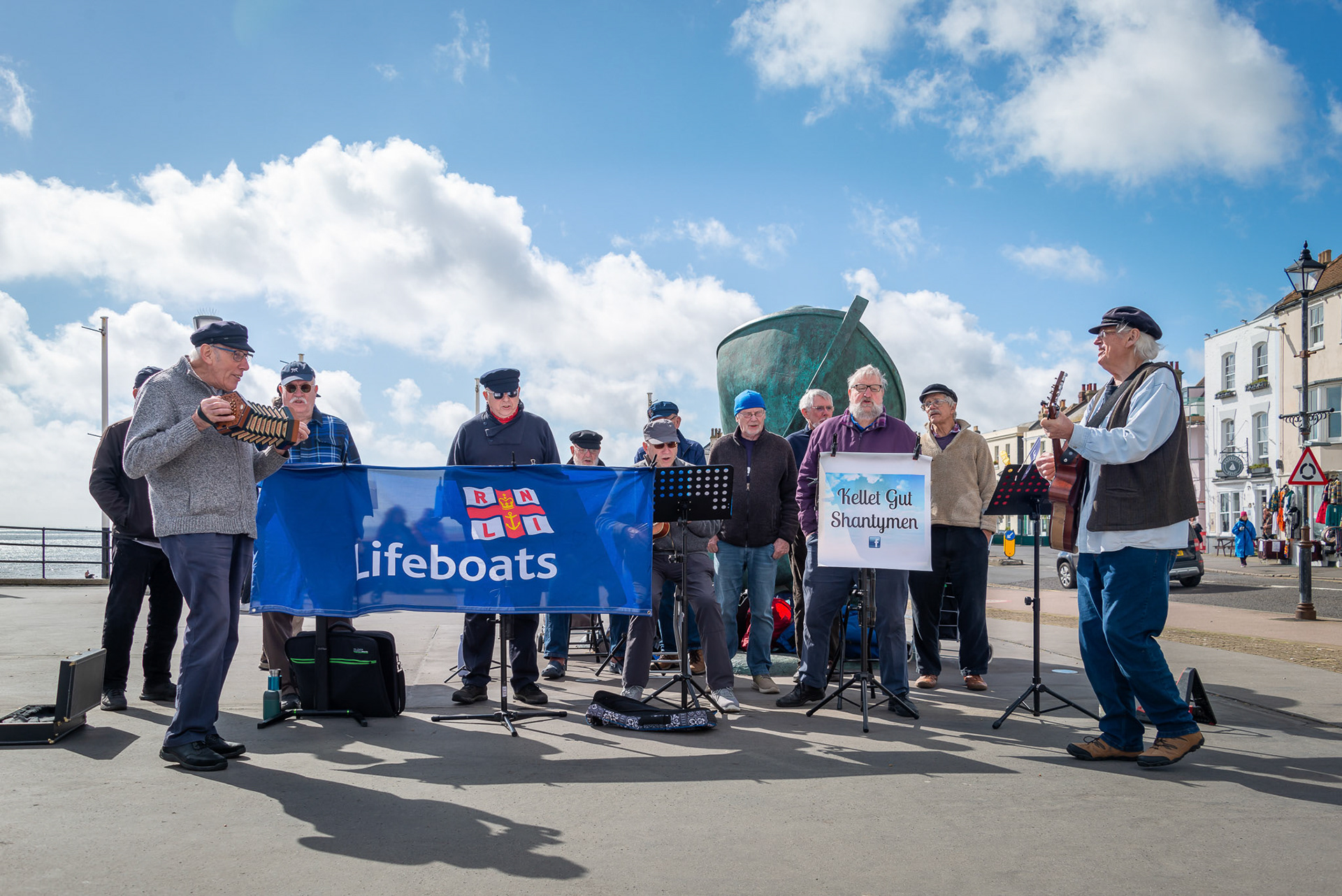 The Kellet Gut Shantymen busking on Deal Pier Approach for Walmer Lifeboats, 1st April, 2024. The Shantymen are from Deal and vicinity. Kellet Gut is an underwater channel between sandbanks in the English Channel, off the coast of Deal.  kelletgutshantymen.wordpress.com