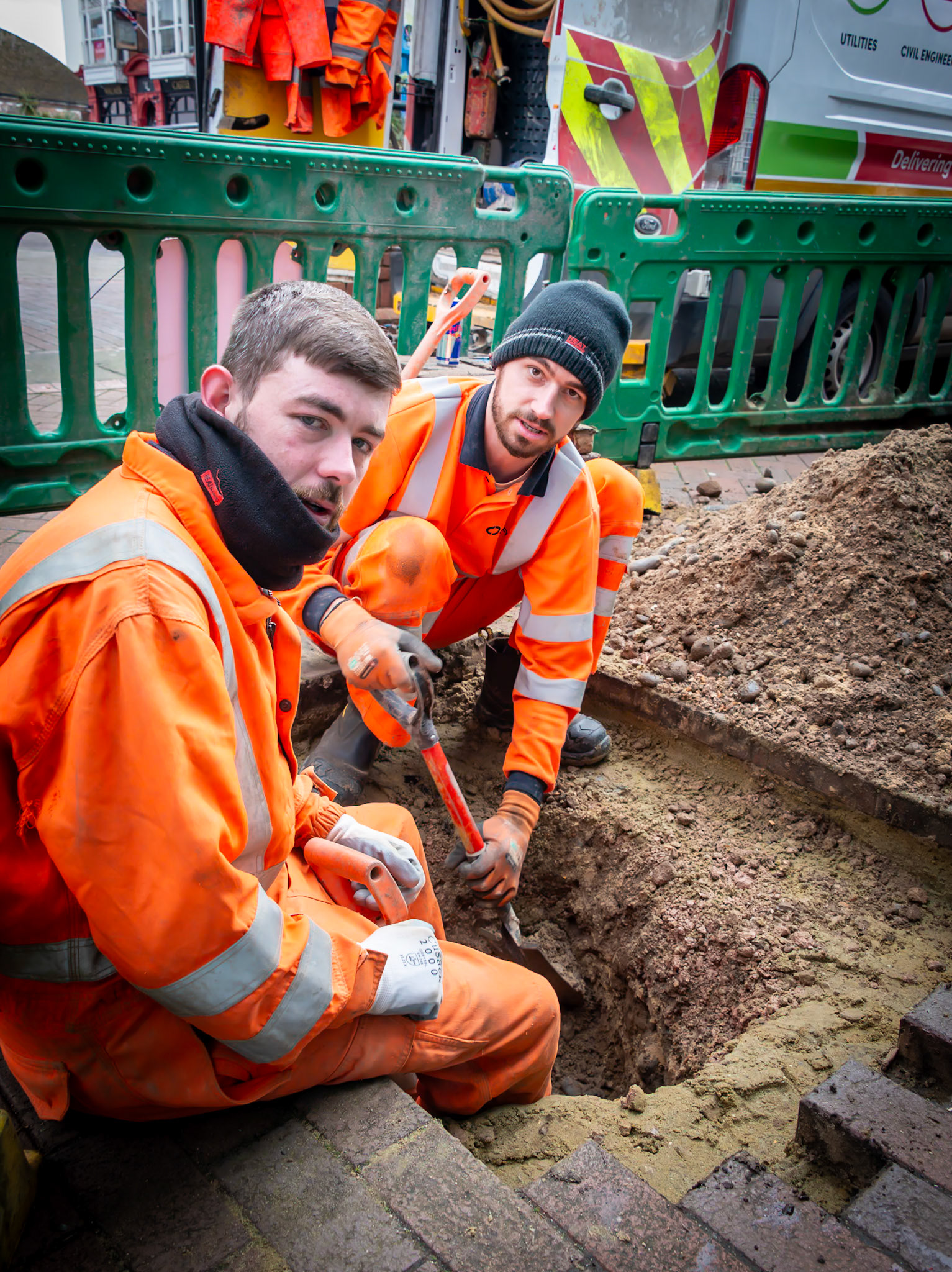 Dave and Myles, residents of Deal and employees of Southern Water, fixing a valve in the water supply. Saturday, Deal High Street, 9th February, 2024.