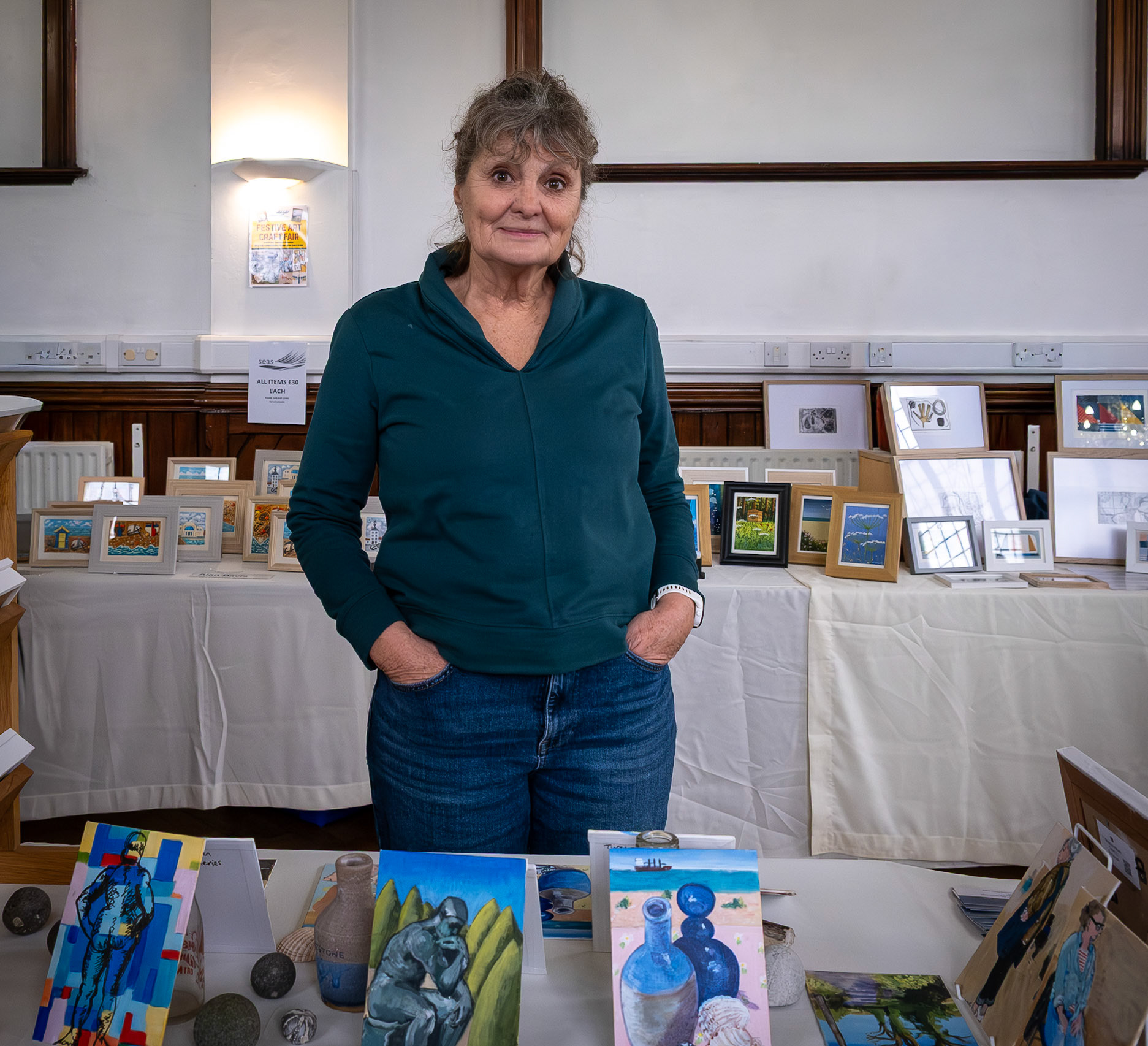 Ginny Davies showing some of her artworks at the Annual Postcard Art Show, The Landmark Centre, 18th November, 2025. 