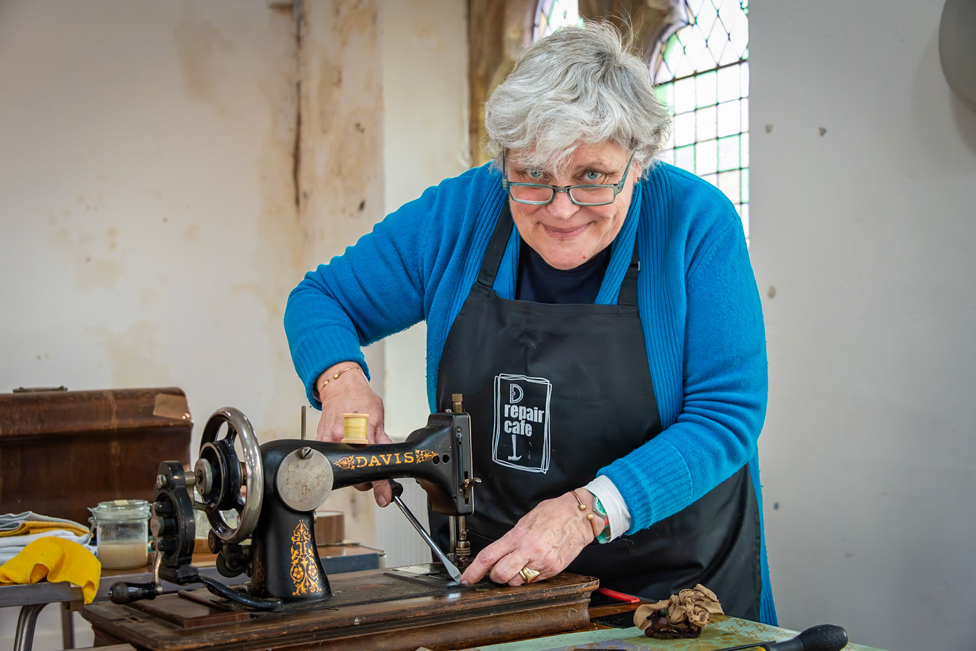 Sarah, a leatherworker and machinist, repairing an old sewing machine, The Repair Cafe, Landmark Centre, Deal High Street, Saturday, 13th January, 2024.