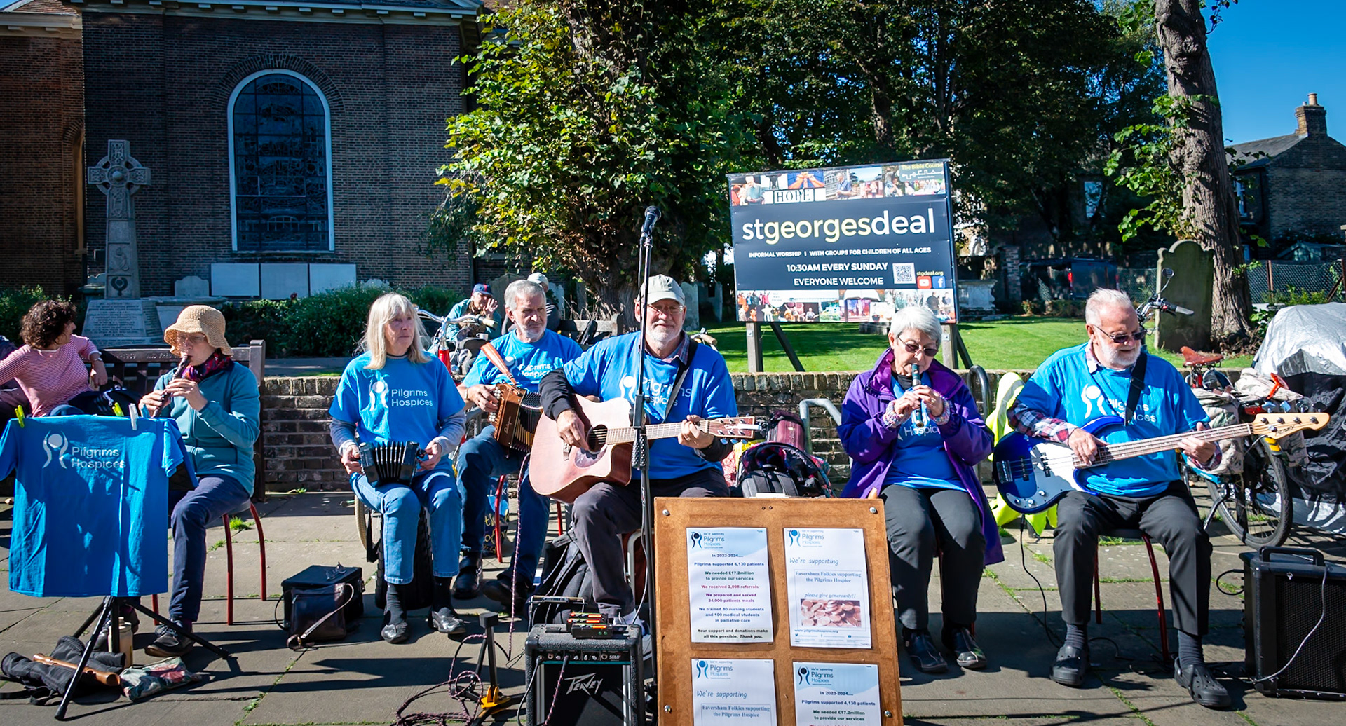 A group of musicians busking for the Pilgrims Hospice. St George's Church, Deal High Street, 28th September, 2024.