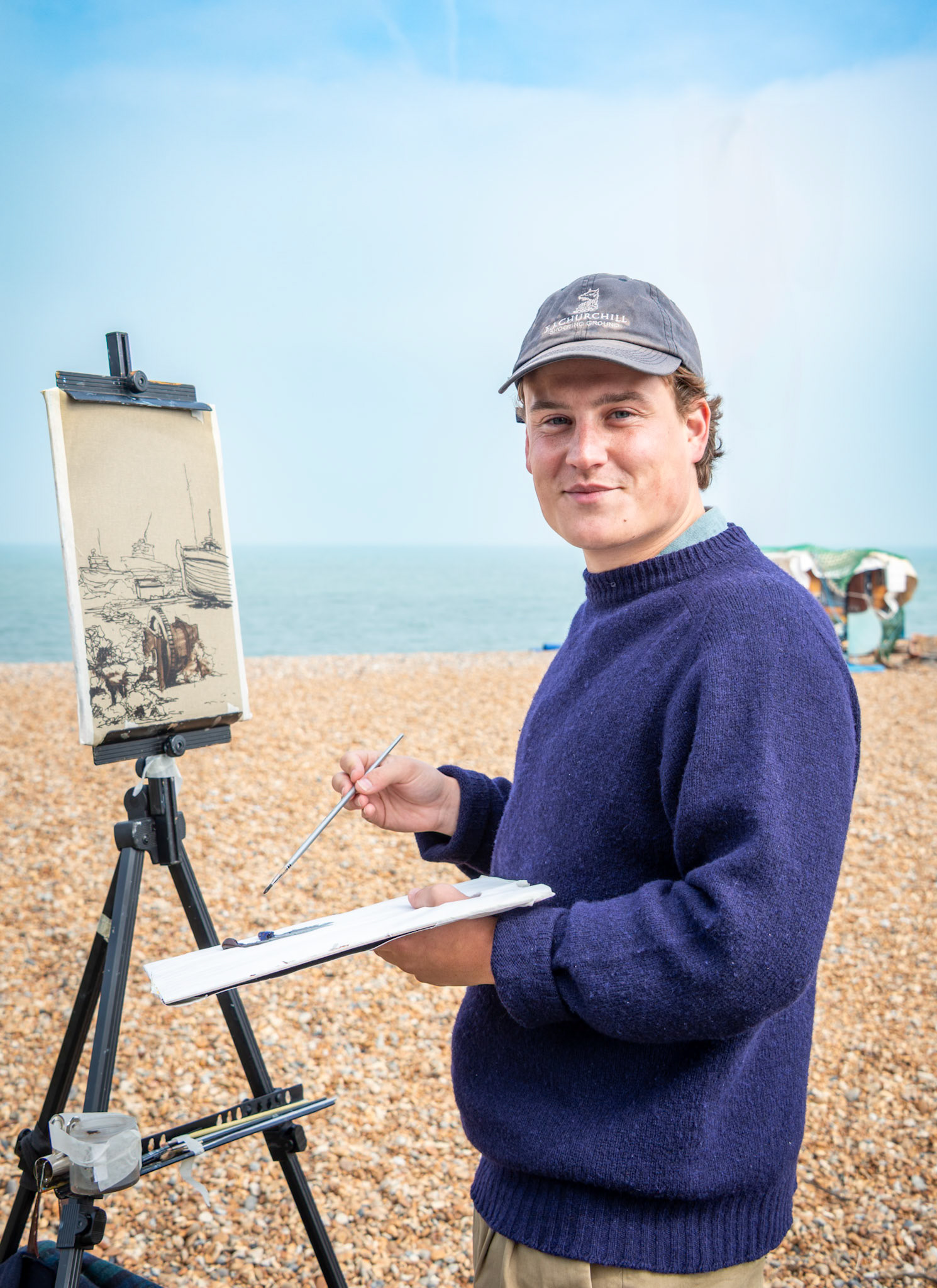 Toby, a painter down from London, capturing the fishing boats on Deal Beach. 25th April, 2025.  
