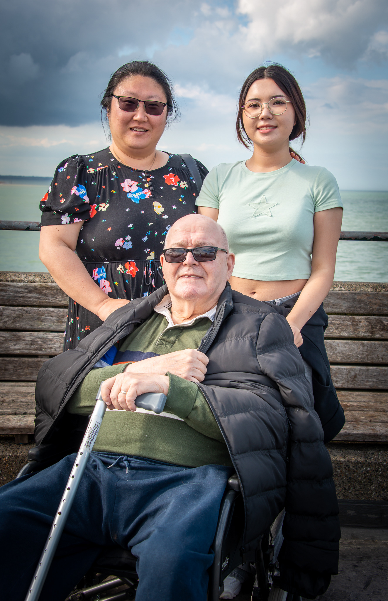 Soonyuong, Rowland and their daughter, Rose, Deal Pier, 22nd June, 2024. Soonyuong was born in South Korea. Rowland lived and worked in South East Asia. They live in Deal where Rose is at school. She is, amongst other things, studying photography.