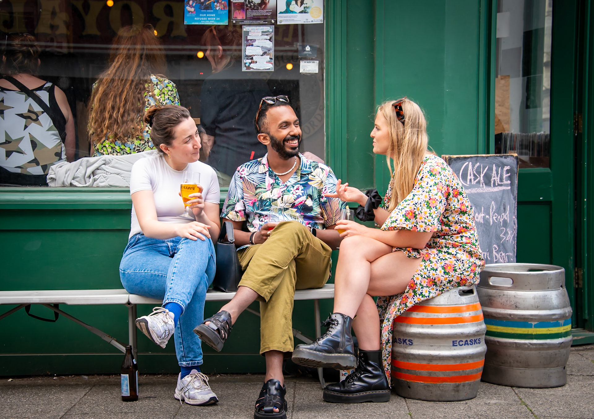 Rachel, Arunan and Lydia chilling out at the Smugglers Record Shop and Micropub, King Street, Deal, 22nd June, 2024. Rachel is a nurse, Arunan is a GP and Lydia is an associate physician.