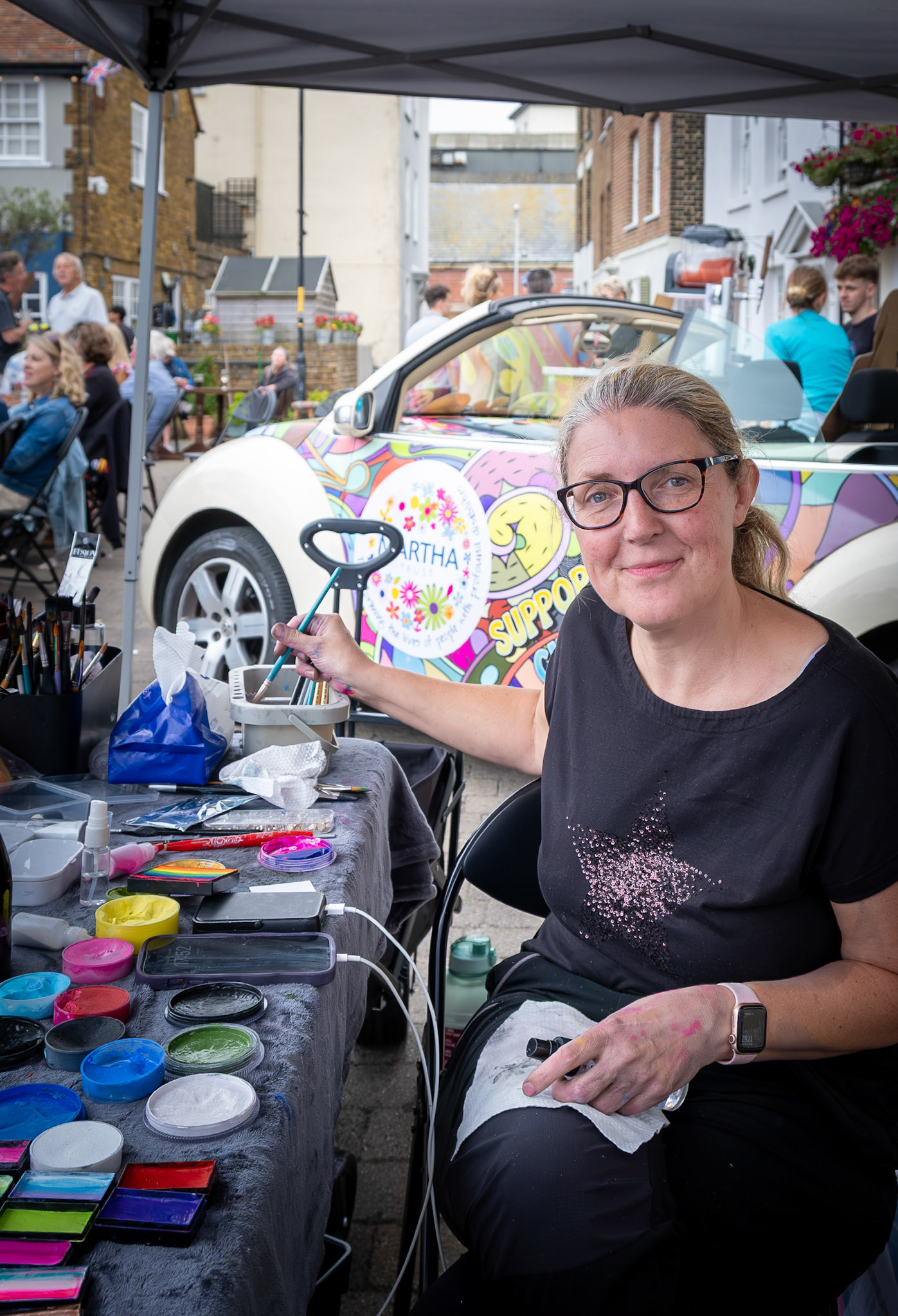 Wendy, a face painting artist at the Martha Trust Charity Concert. 3rd August, 2025.