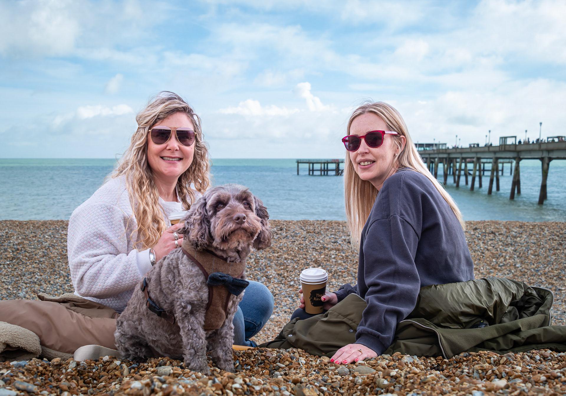 Laura and Jeska having coffee on Deal Beach, alongside the Pier, 1st April, 2024. Laura is a designer of wedding rings and Jeska designs wedding dresses at her shop The Bridal Boutique of Jules, Dover Road, Walmer. https://www.boutiqueofjules.co.uk/