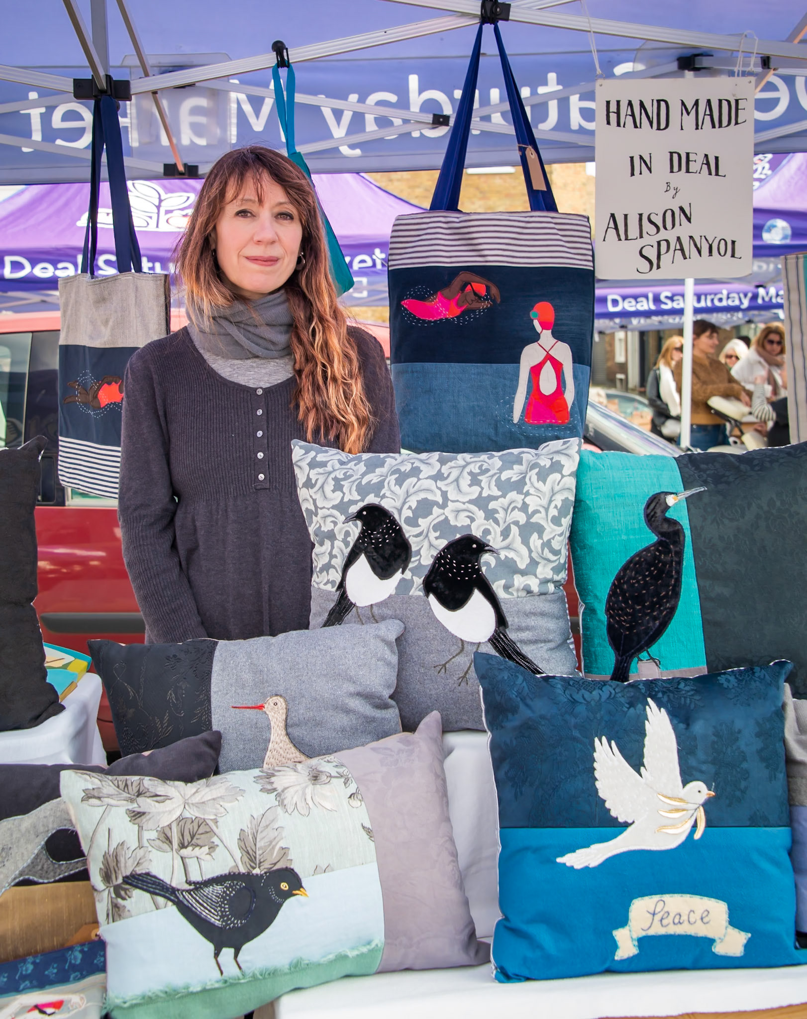 Aliso Spanyol at her stall in Deal Market, 16th March, 2024. Alison sells hand made bags and cushions of her own designs.