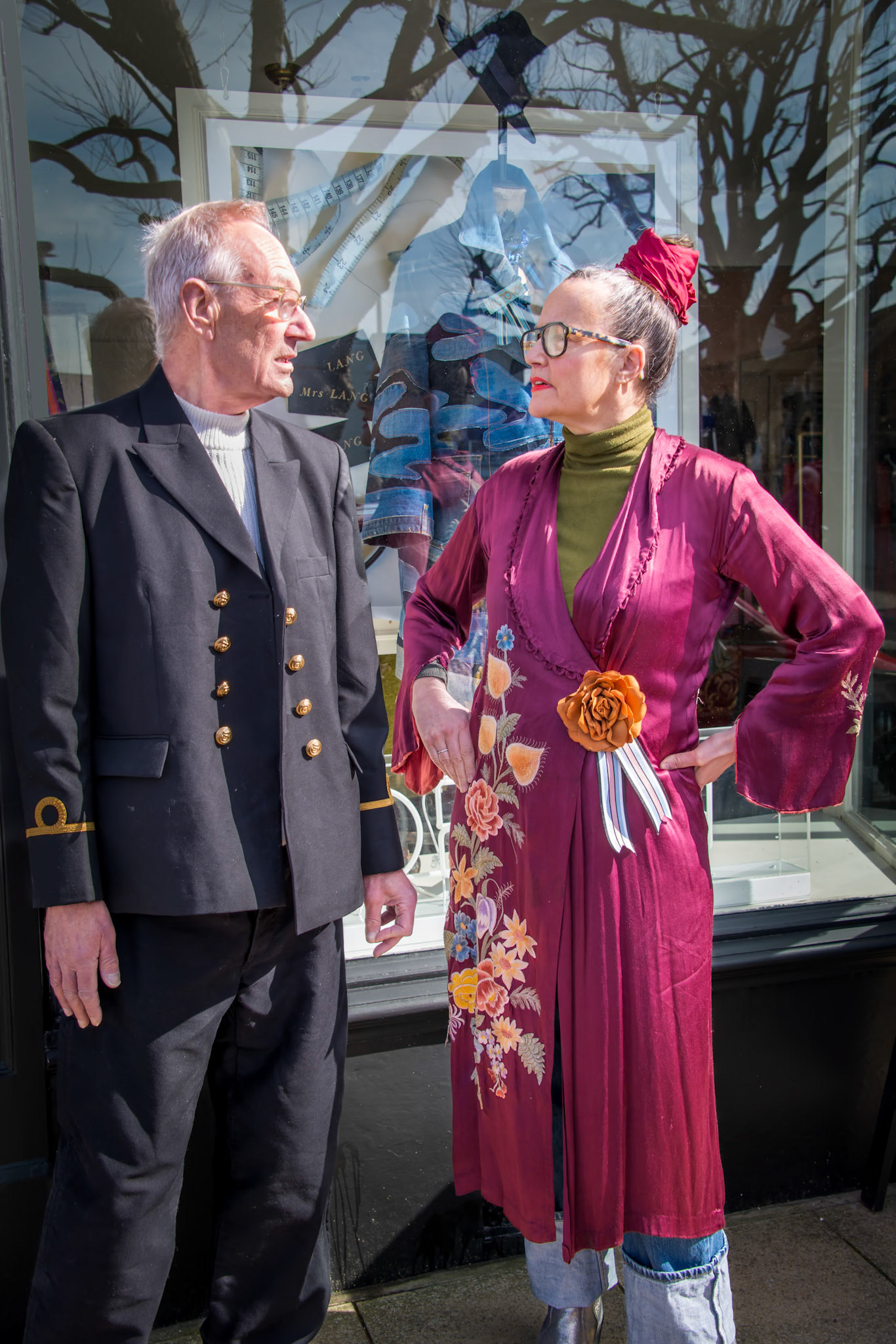 Andrew and Roni outside Roni's shop, Mrs Lang, Deal High Street, 16th March, 2024.  Roni is the owner and Customising Queen behind the Mrs Lang boutique. Upcycled, reloved, unique and luxury clothing plus nightwear, accessories and homeware. Andrew was in retail and HR.