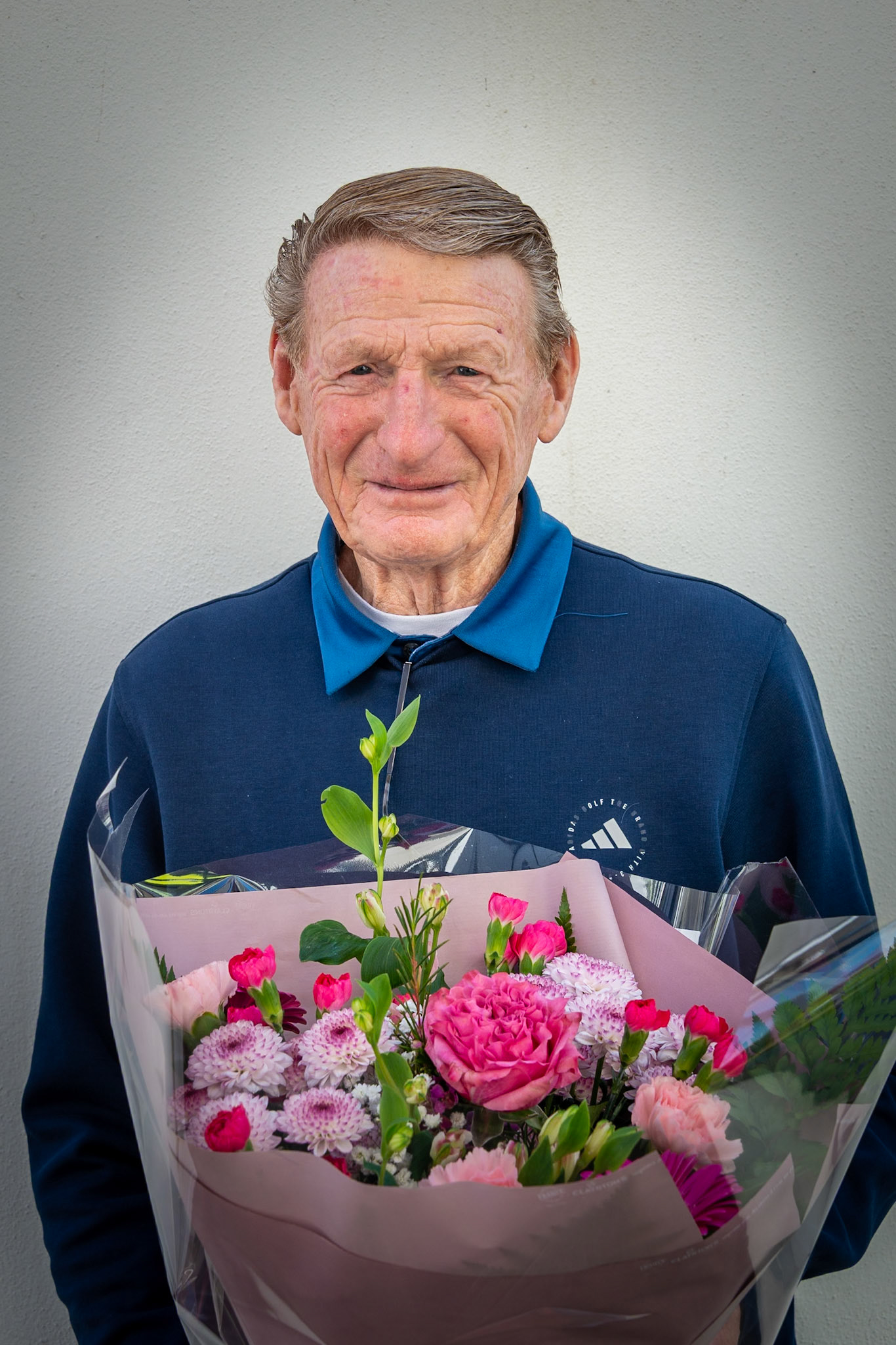 Graham Dear, a former Regimental Sergeant Major in the Royal Marines and bodyguard to the Queen. Graham was made an MBE in the New Year Honours in 1989 for his service to the Royal Marines. He was later the Principal Doorkeeper at the House of Commons, responsible for the security of the Chamber. In 2014, Graham was awarded the Royal Victorian Medal in recognition of his role in the Queen’s Body Guard of the Yeoman of the Guard. The medal is only awarded to members of the Royal Household. When I met him in Deal Town Centre, he had won a golf match that morning with a massive score of 46 points. The flowers were for his dear wife. 29th March, 2025.