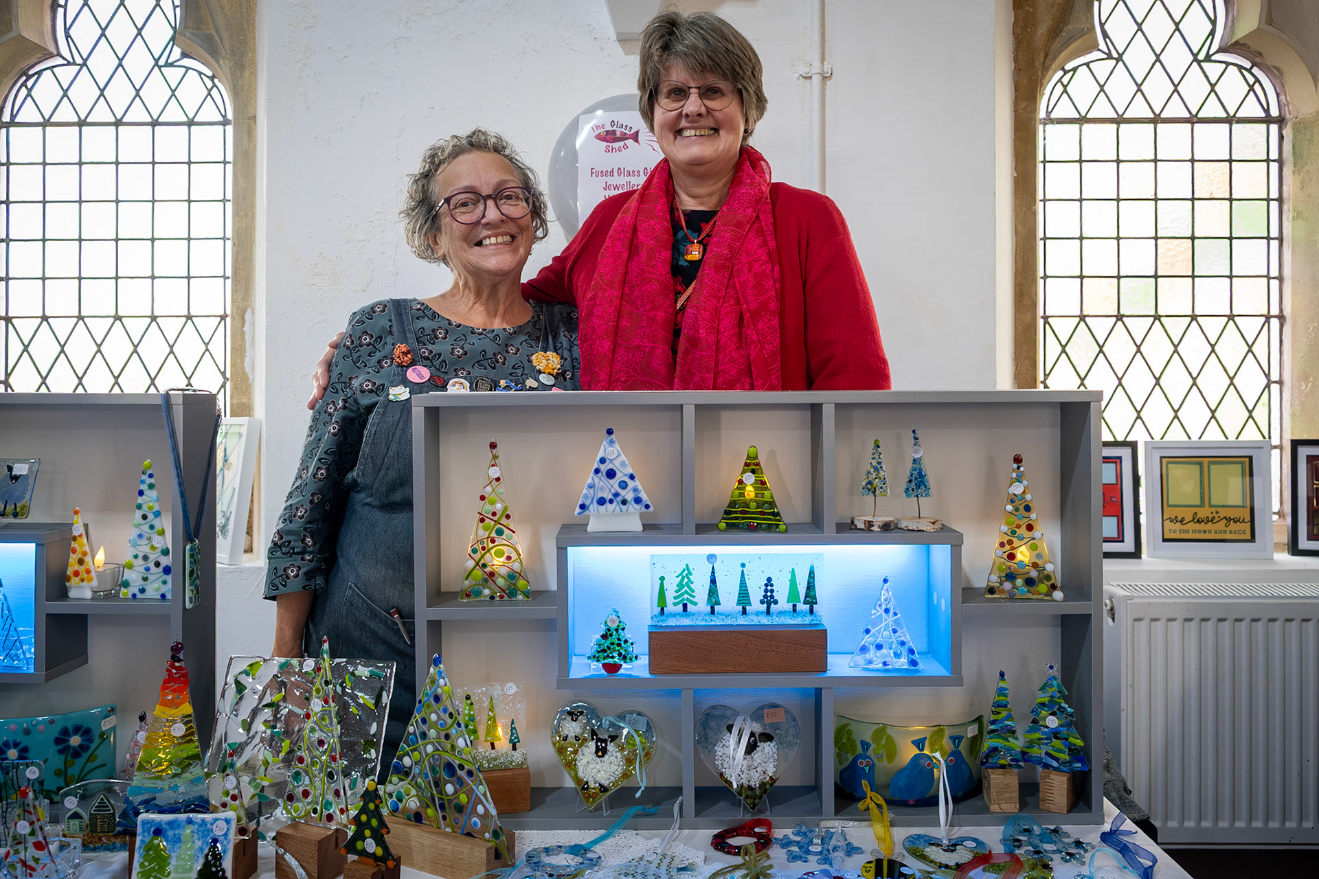 Flavia Pietroforte and Sue Chapman of the Glass Shed, Worth. Makers of dichroic glass jewellery and stuff. Craft Fair at the Landmark Centre, 22nd November, 2025.