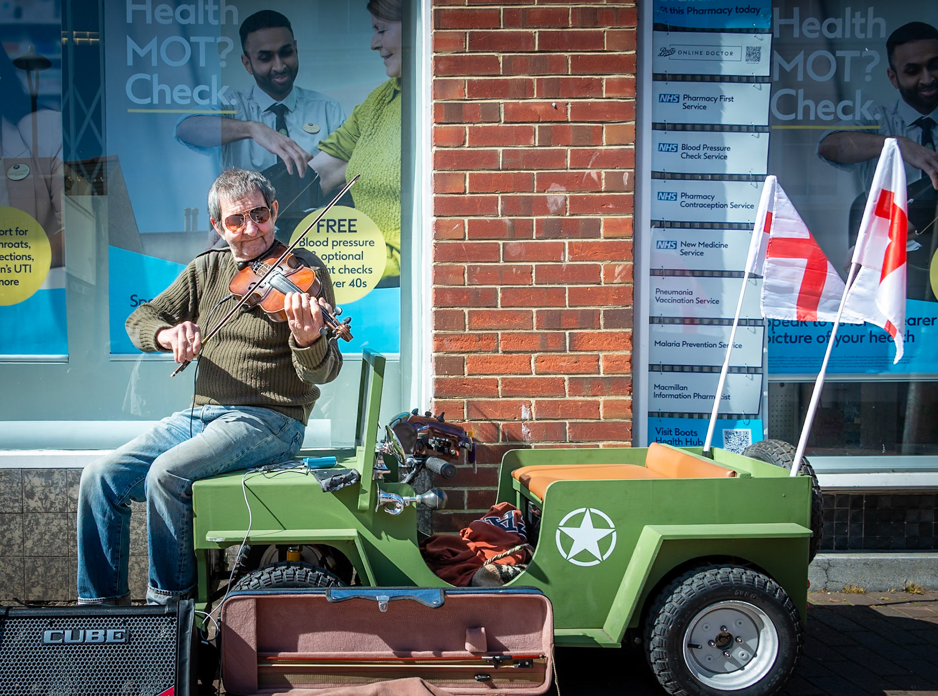 Peter Chittenden, fiddle player, experimental inventor, banjo and ukulele maker and convereter of mobility scooters. High Street, Deal, 29th March, 2025.