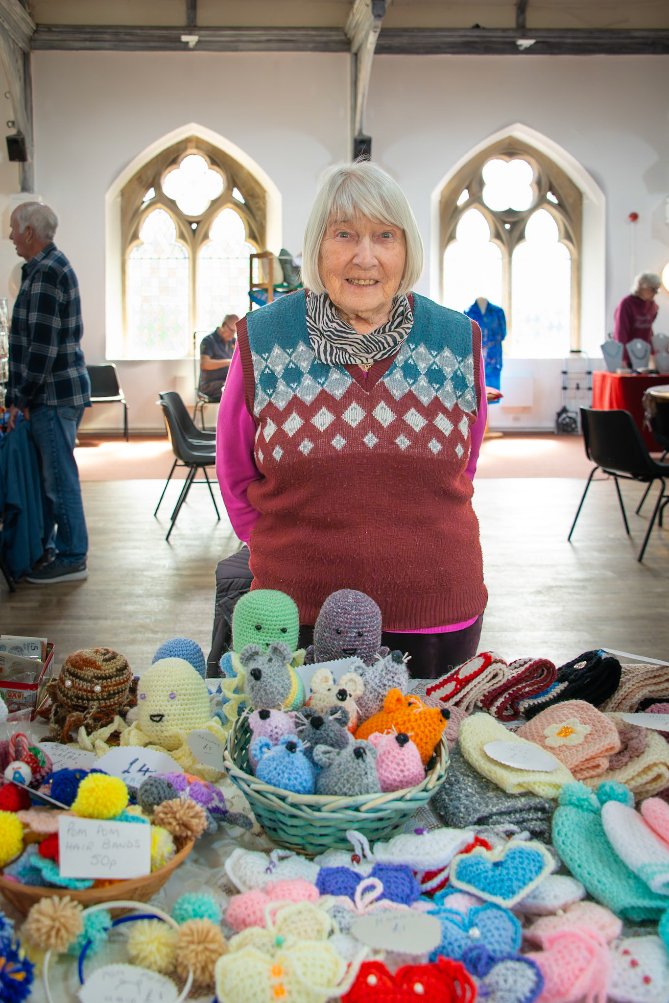 Mave who makes crocheted toys and other objects.  Craft Fair for the Leaps and Bounds Community Project, The Landmark Centre, 12th April, 2025. The project promotes independence and provides skills for adults with learning disabilities.
