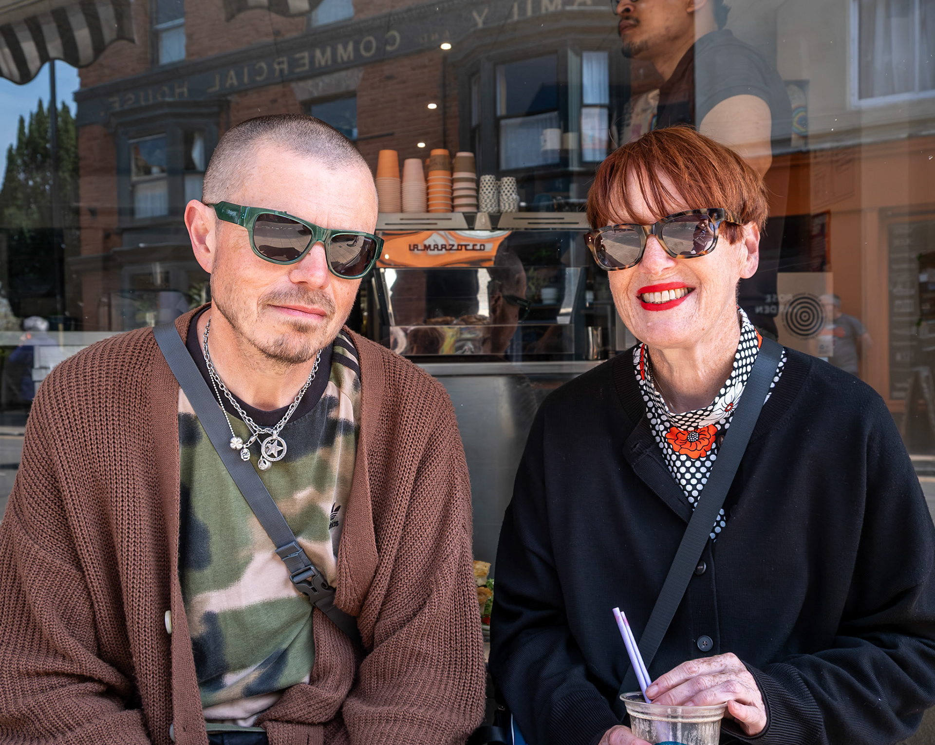 John and Jackie enjoying a coffee outside Cimpson and Sons Cafe, 86 High Street, 9th May, 2026. John is a Level Crossing Manager (I have never met one of those before) and Jackie is a finance officer with Hebron Housing: Supported Housing for Women. https://hebronhousing.org/ https://climpsonandsons.com/ 