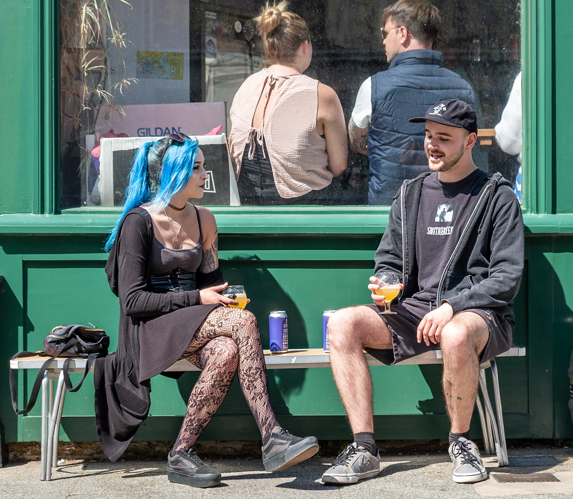Amy, a Lab Technician and Max, a baker, enjoying a drink outside Smugglers Records and Bar, King Street, 9th May, 2026. 