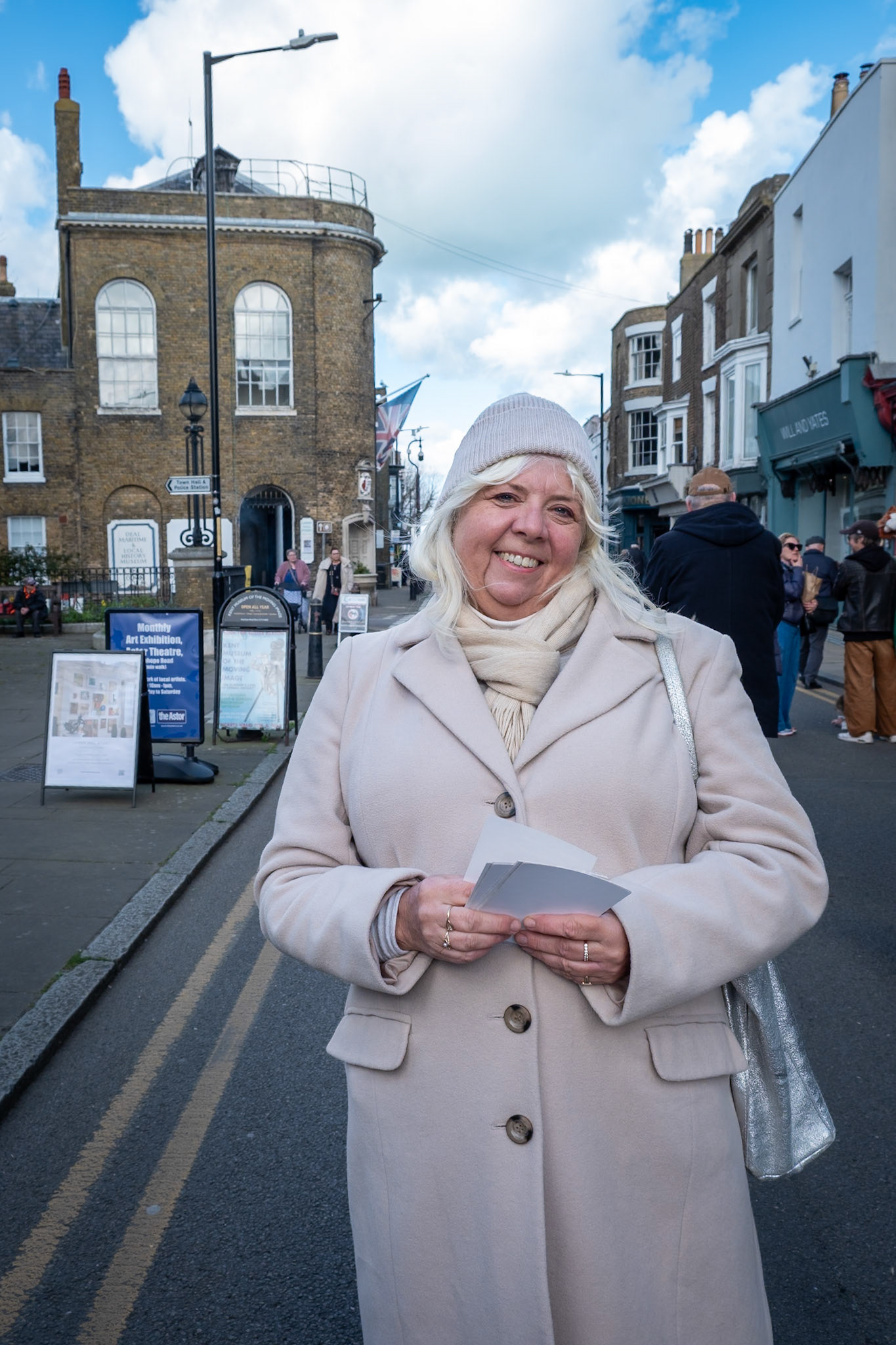 Ann Beresford a member of The Deal and Walmer Handelian Choral Society, in the High Street, 14th March, 2026. Ann was advertising a production of Carl Orff's Carmina Burana which will take place at 7.30pm, 21st March, 2026 at St George's Church.