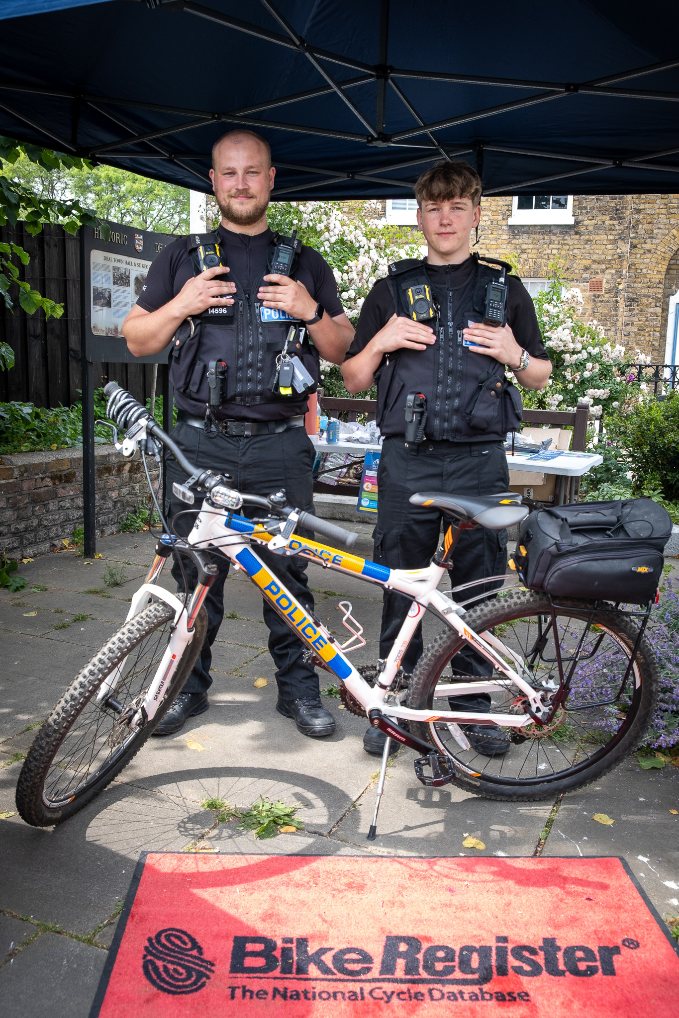 Kyle and Adam of the Kent Constabulary, marking bicycles to avoid theft and aid recovery. Forecourt to St Georges Churchyard, 20th June.