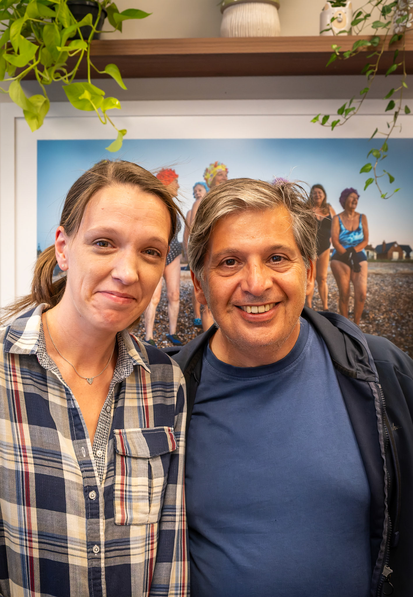 Kimberley Arnold and Mario Socrates, local photographers, at Joe Navin's Private View of his exhibition Street and Landscapes at Lole Wellness Cafe, 8th August, 2026.