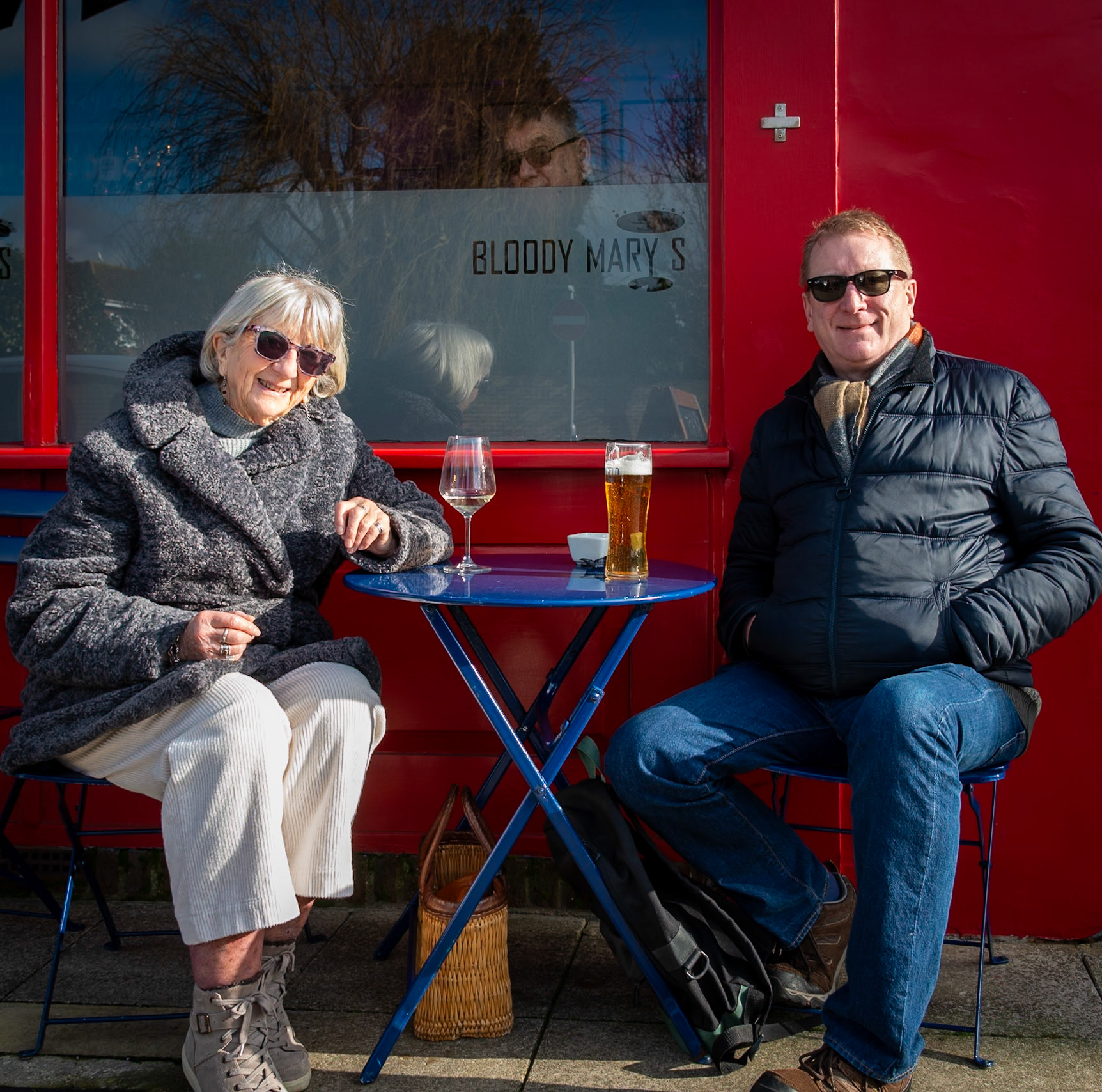 Alison and her son Edward having a drink outside Bloody Mary's, High Street, 1st February, 2025.