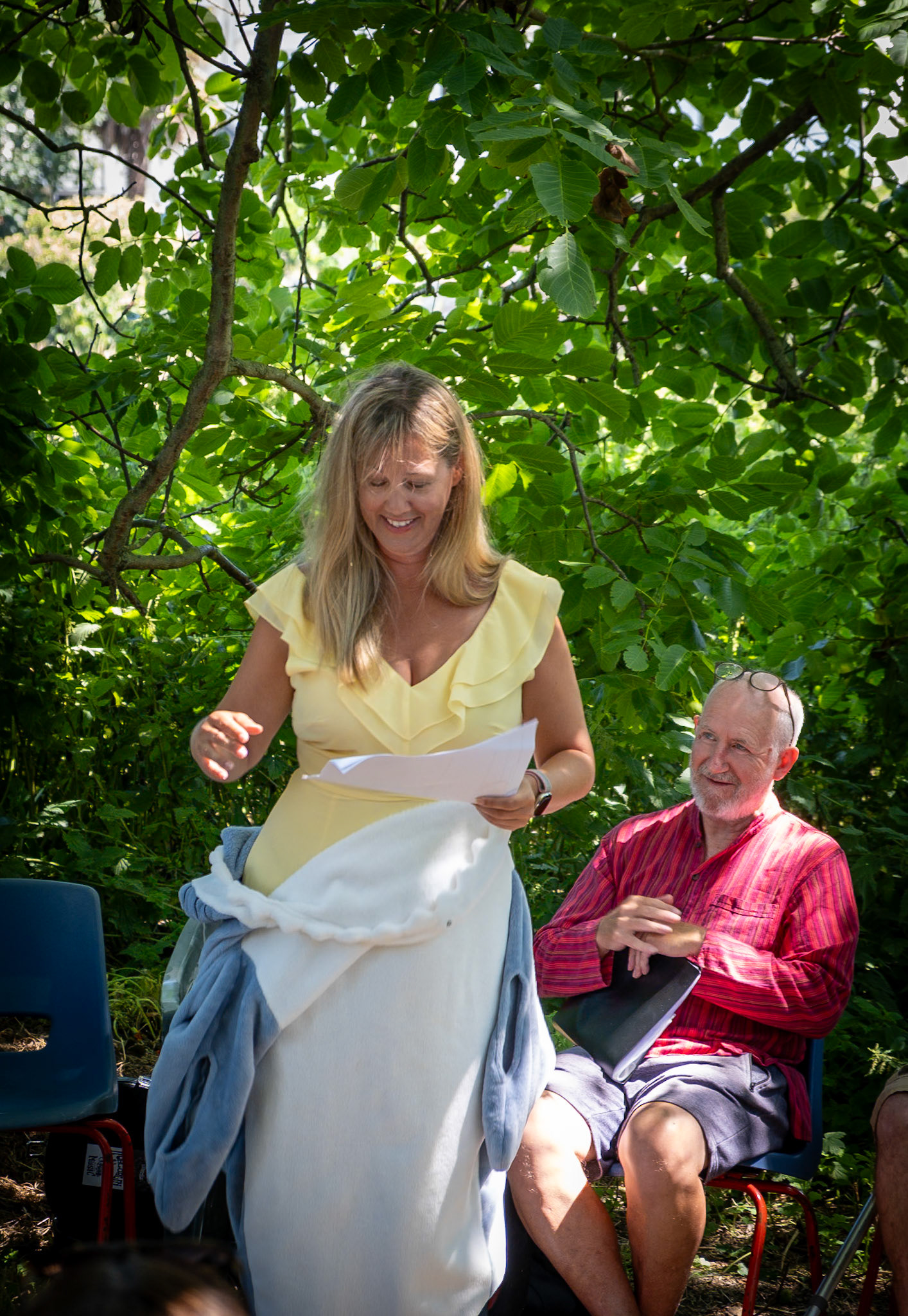 Caroline stepping out of her dolphin suit/ Poetry readings at the Captains Garden Open Day 