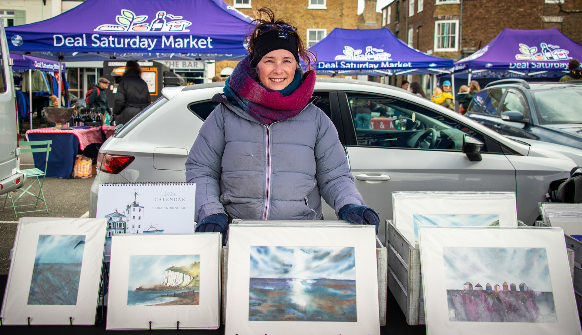 Flora Andrino, a French Guatemalan watercolour artist at her stall in Deal Market, 22nd March, 2024. Flora specialises in etheral, semi-abstract landscapes inspired by the spectacular scenery encountered in her travels. She moved to Deal from Wānaka, South Island, New Zealand. I can testify that the scenery there is beyond spectacular. www.floraandrinoart.com