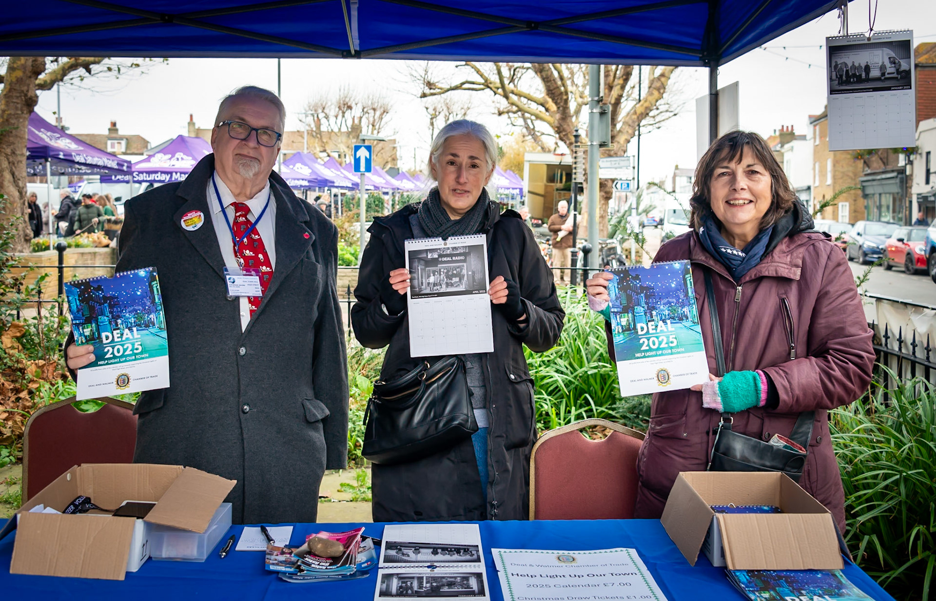 Town Councillor Michael Walters, Debbie a volunteer and Julie, a committee member of the Chamber of Trade, promoting the work of the Chamber. Landmark Centre, 20th November, 2024.