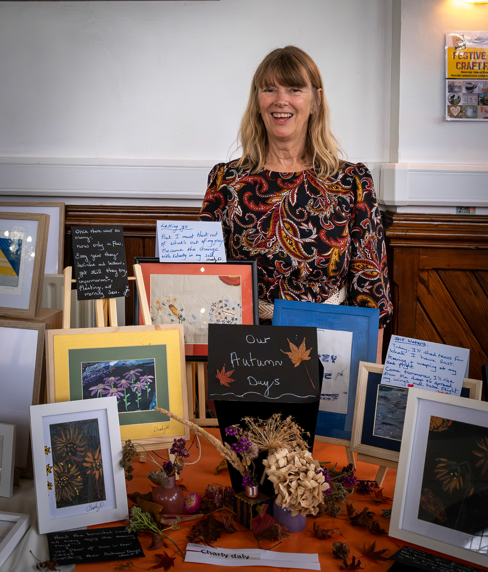 Charly Daly showing a small selection of her artworks at the Annual Postcard Art Show, The Landmark Centre, 18th November, 2025. Charly hails from Cork and loves to create her own interpretation of Irish folklore myths and legends. She writes poetry and songs and often paints what she has written or writes about what she has painted. 
