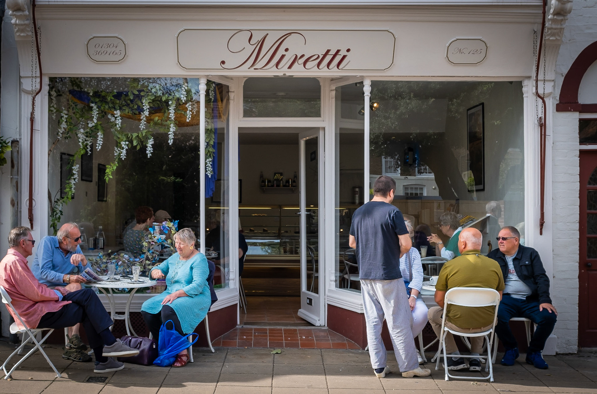 Locals enjoying coffee and conversation at Miretti's on Market Day