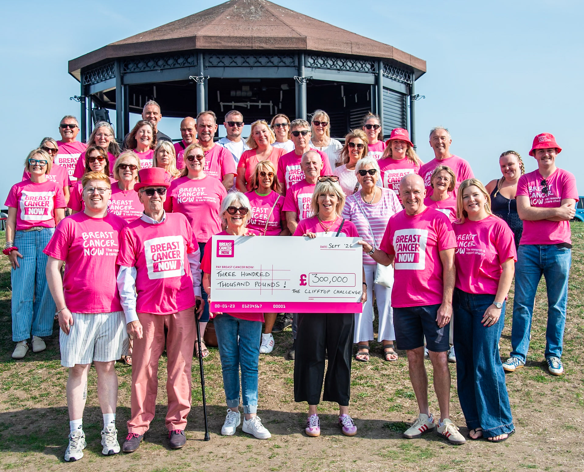 The incredible Clifftop Challenge Family, presenting a cheque for an incredible £300,000, raised by the Clifftop Challenge, to Breast Cancer Now. Front row from left to right is the Griggs Family at the centre of the organisation of the Clifftop Challenge: Charlie, Mike, Jenny, Chantelle, Phil and Lily. Deal Memorial Bandstand, 27th September, 2026. 