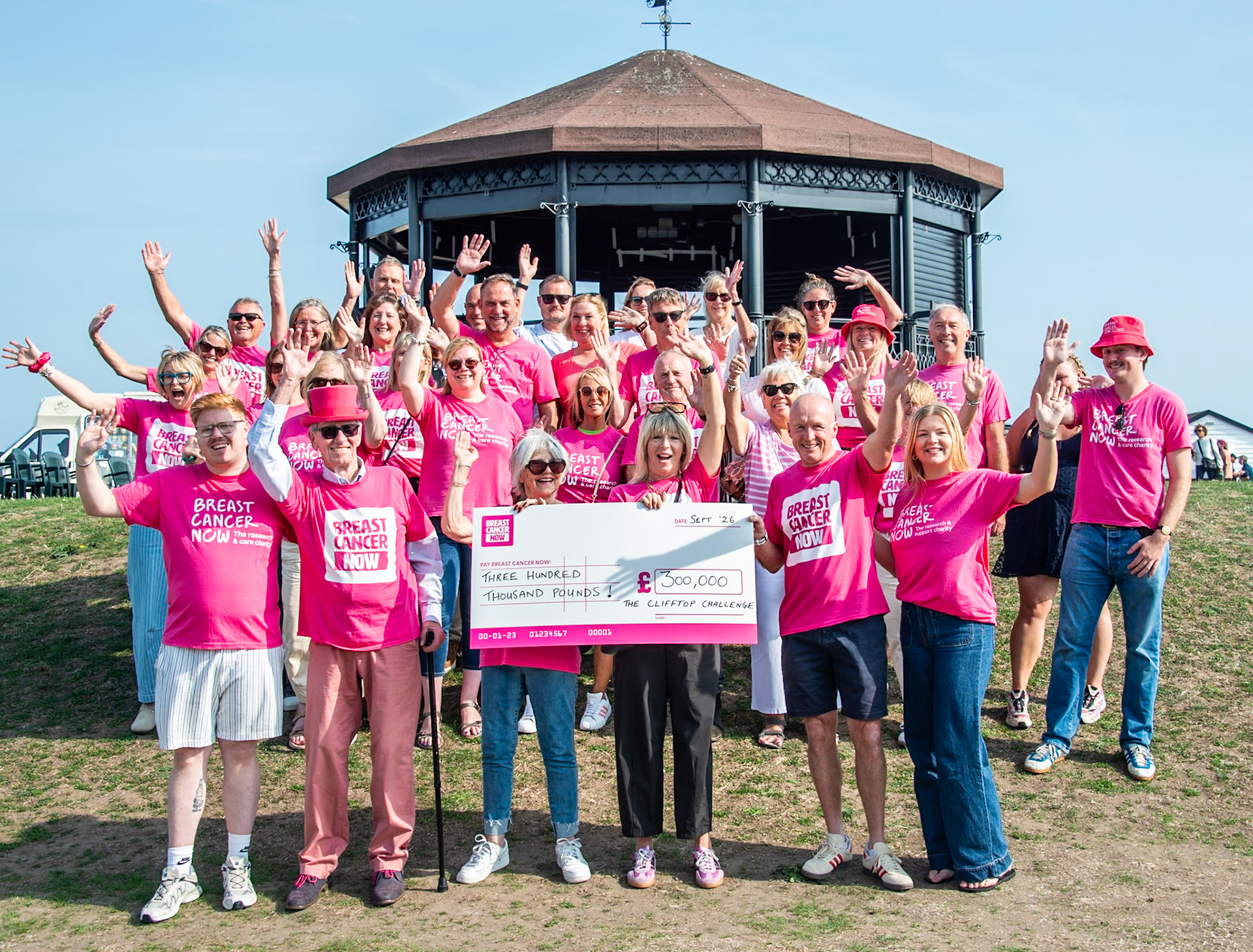The incredible Clifftop Challenge Family, presenting a cheque for an incredible £300,000, raised by the Clifftop Challenge, to Breast Cancer Now. Front row from left to right is the Griggs Family at the centre of the organisation of the Clifftop Challenge: Charlie, Mike, Jenny, Chantelle, Phil and Lily. Deal Memorial Bandstand, 27th September, 2026. 