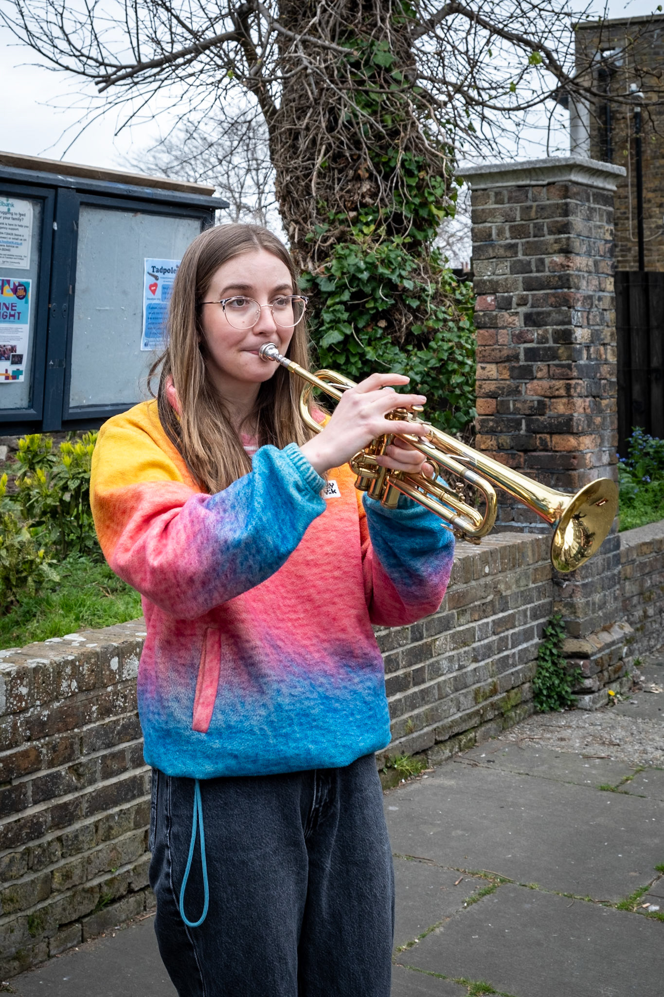 Ellie, who works in a primary school, playing the trumpet rather well outside St George's Church, 11th April.