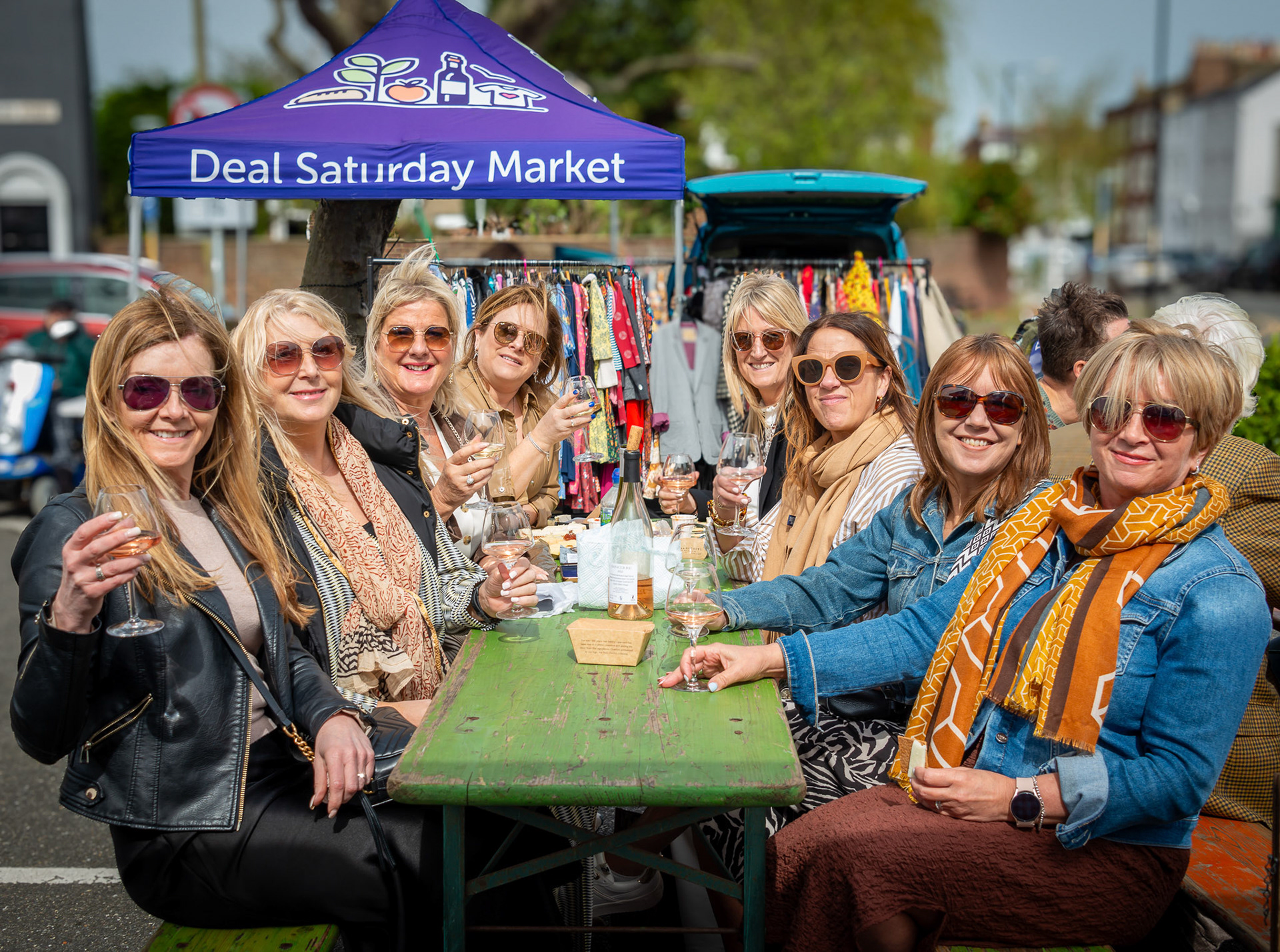 Eight ladies down from that London for a birthday celebration. From left to right: Caroline, Sue, Amanda, Nancy, Sam, Debbie, Tina and Kim. Pascal's Wine Stall, Deal Market, 6th April, 2024.