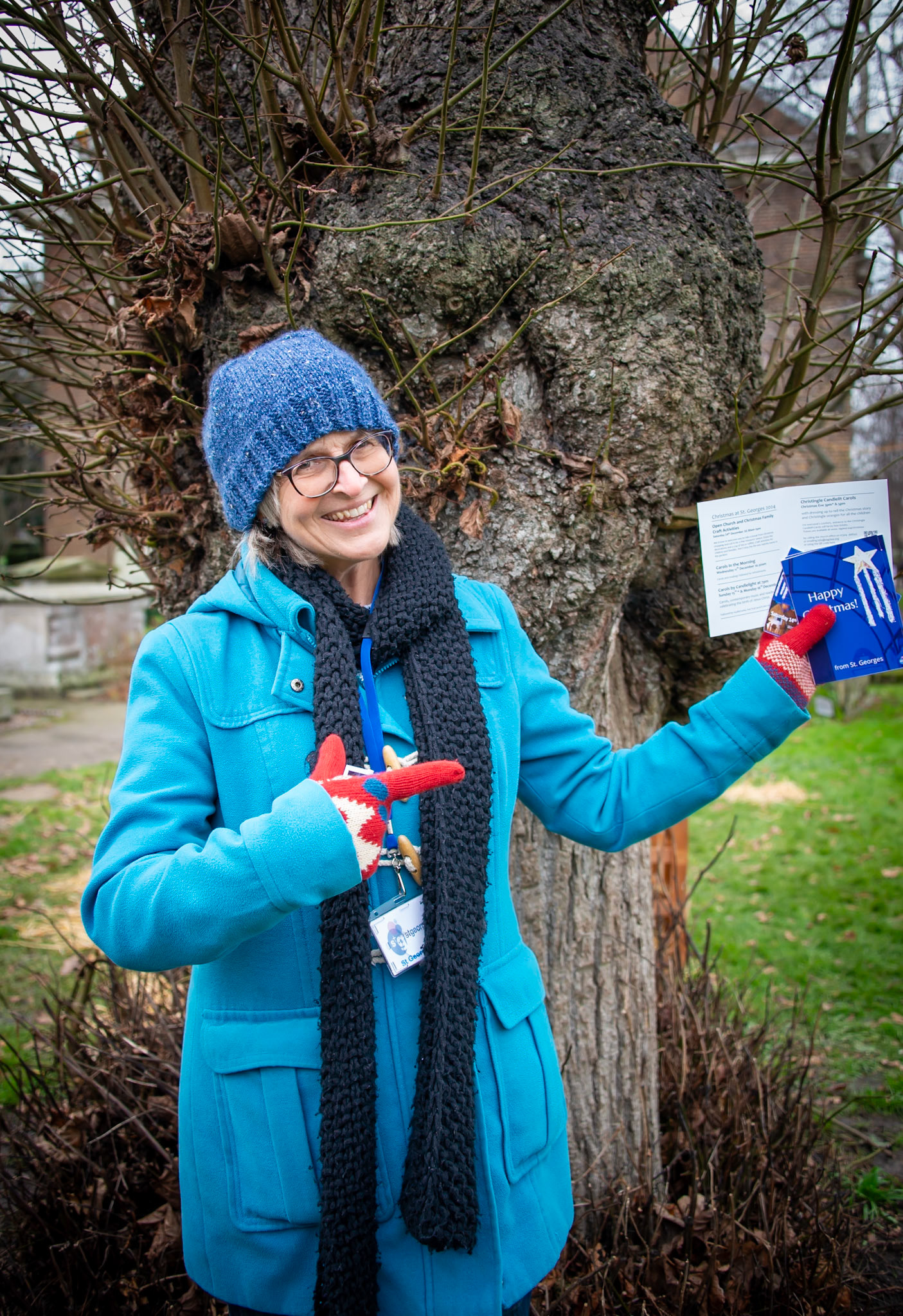 Lynne, a retired teacher, advertising the Family Crafts Day at St Georges Church, 14th December, 2024.