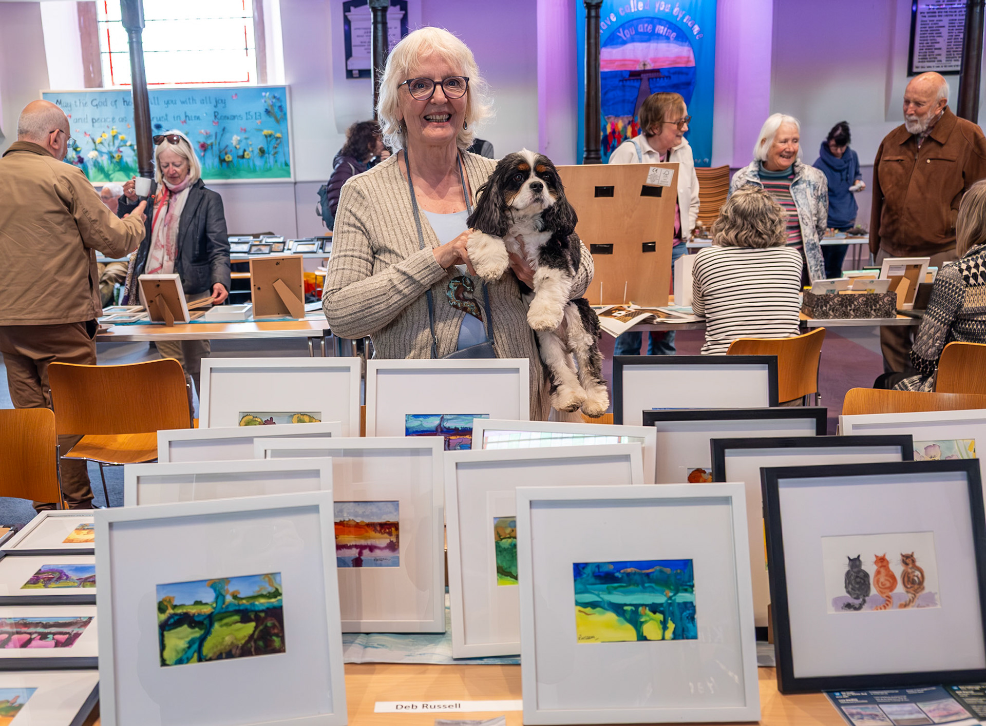 Deb Russell, artist, and her dog Teddy, at the Small is Beautiful launch event for next month's Open Studios.  St George's Church, 16th May, 2026.