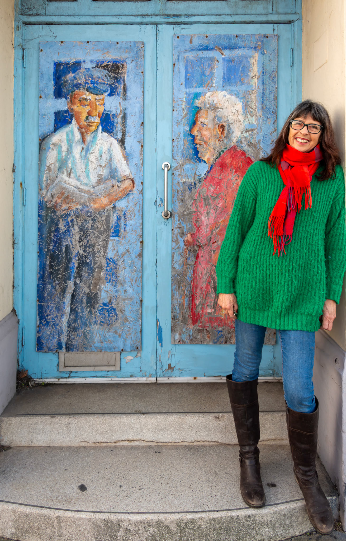 Penny Bearman at the Old Regent Cinema, Beach Street, Deal, 28th January, 2024. Penny painted the murals on the boarded up doors of the Art Deco front of the building in August 2009. Sadly, the building is still dilapidated and unused with a continuing planning dispute about its future. http://www.pennybearman.co.uk/Regentmurals.html