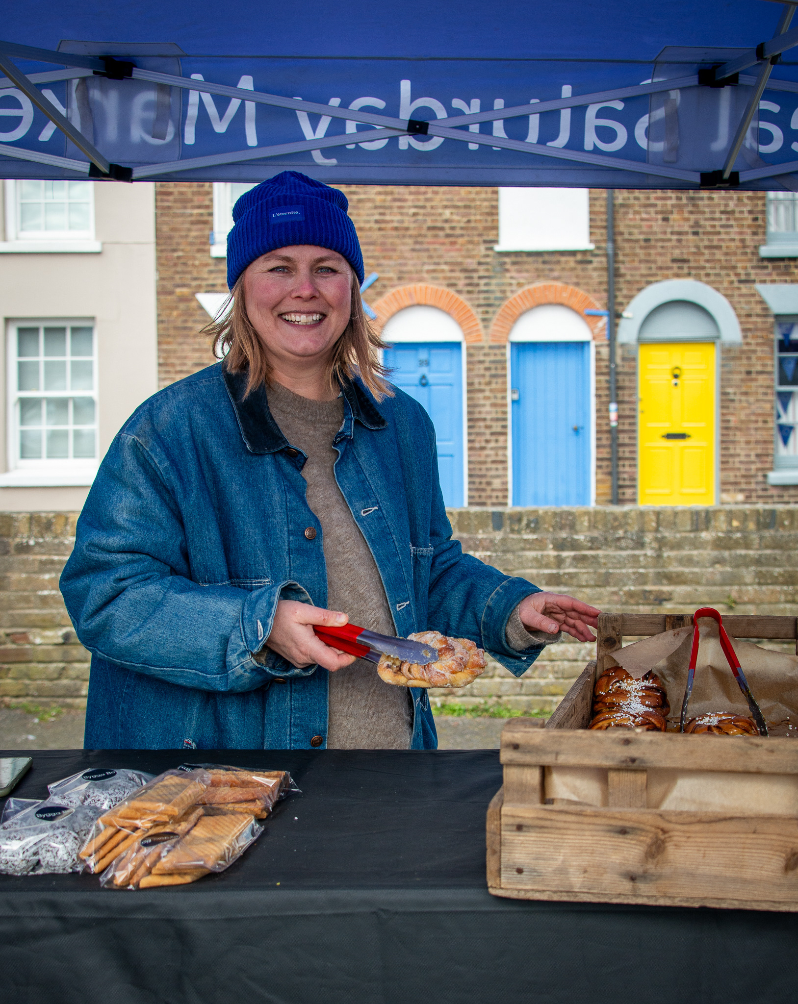 Malin, from Sweden, at her cake stall in Deal Market, 14th, March, 2025.