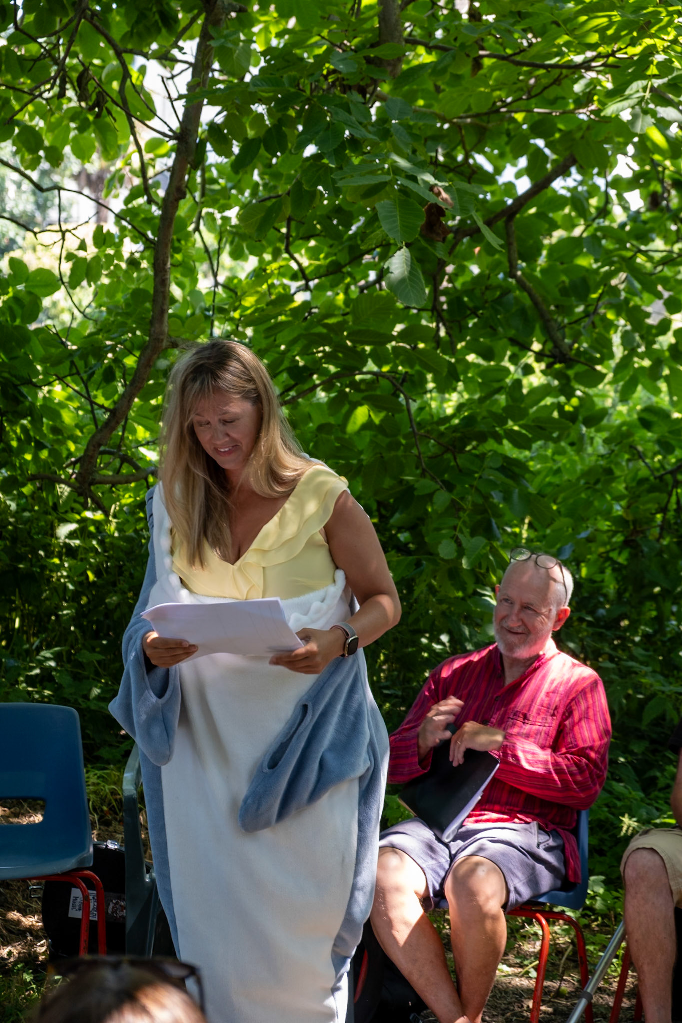 Caroline stepping out of her dolphin suit/ Poetry readings at the Captains Garden Open Day 