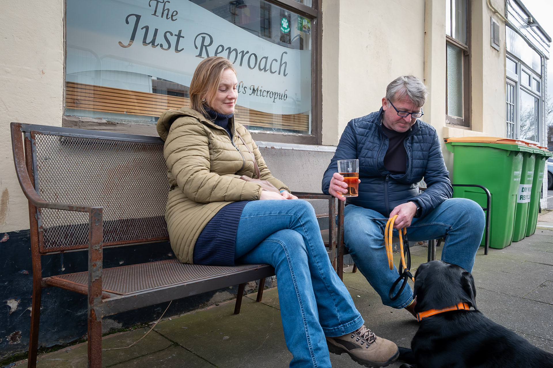 Naomi and Chris with their black lab, outside the Just Reproach. 21st Feb.