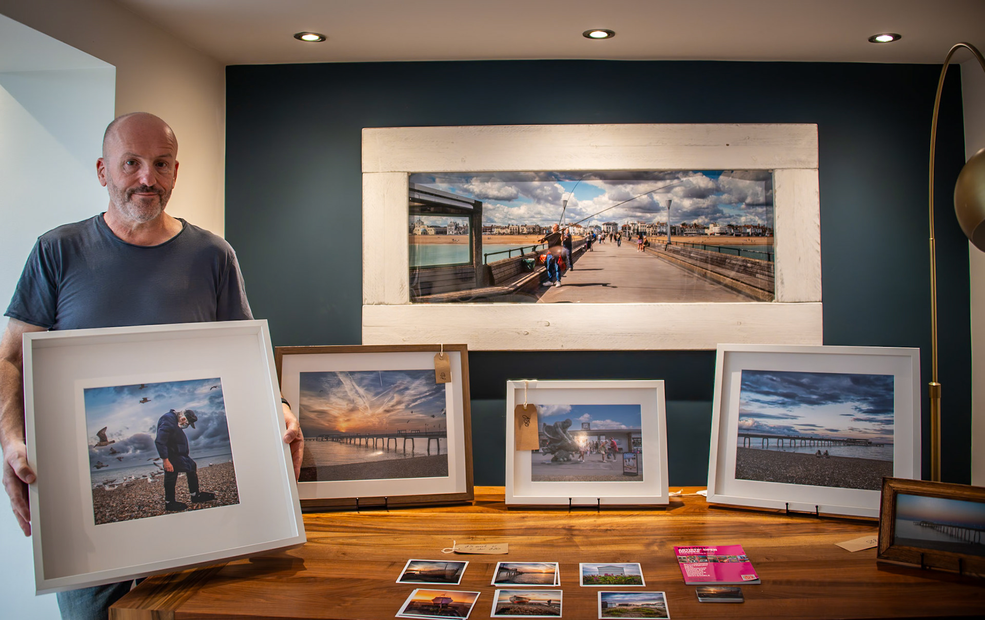 Joe Navin, Leica user, street, portrait and landscape photographer at his first exhibition in the East Kent Artists Open Houses, 26th October, 2024. Joe was showing a large and impressive collection of beachfront photographs which he captured during his first year in Deal. His main challenge, he told me, was the transition from monochrome street photography in London to the dawn sunrise, colour palette of the East Kent Coast.