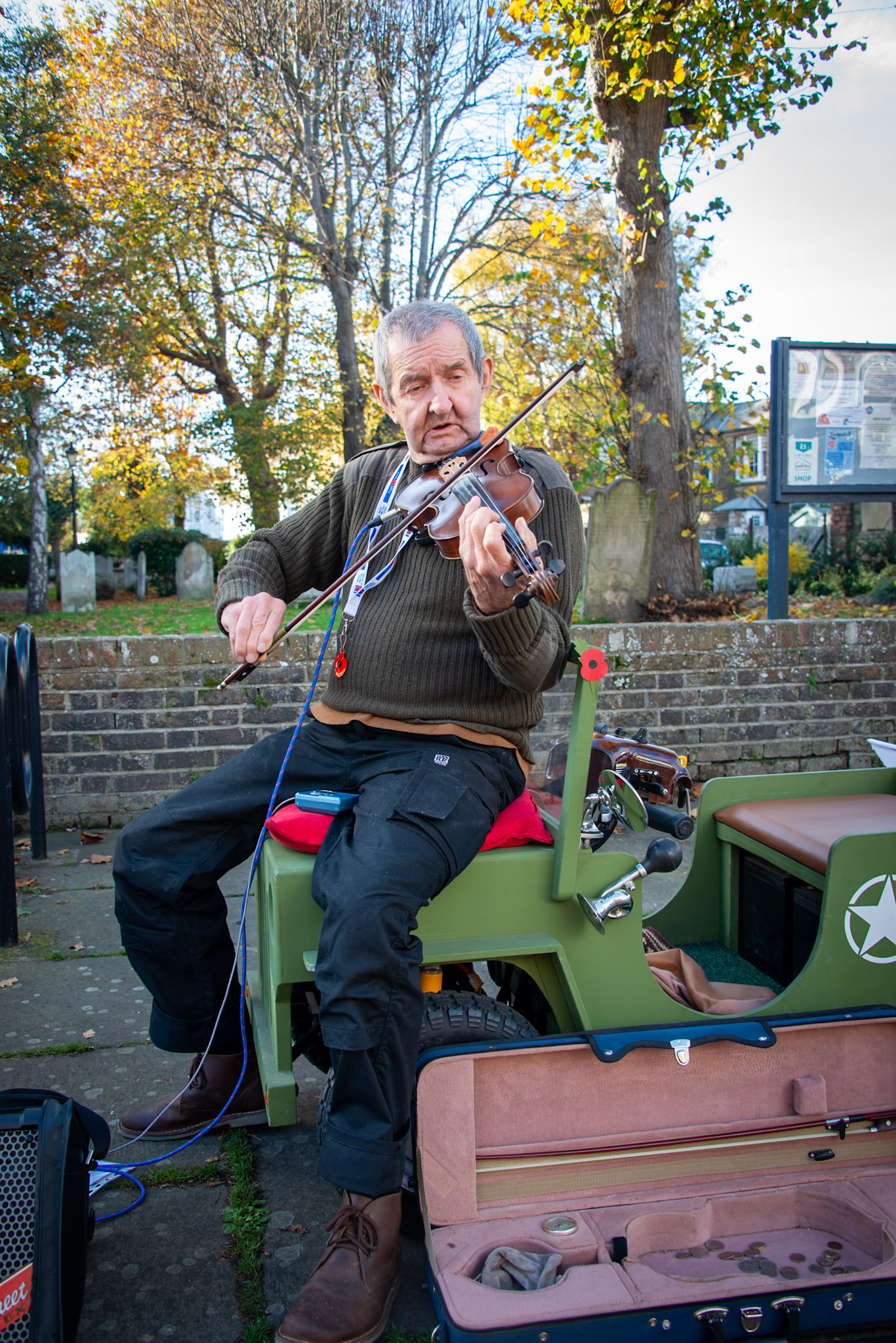Peter Chittenden, inventor, maker of custom built mobility scooters, banjo, ukelele and violin player. St Georges Church forecourt, 8th November, 2025. 