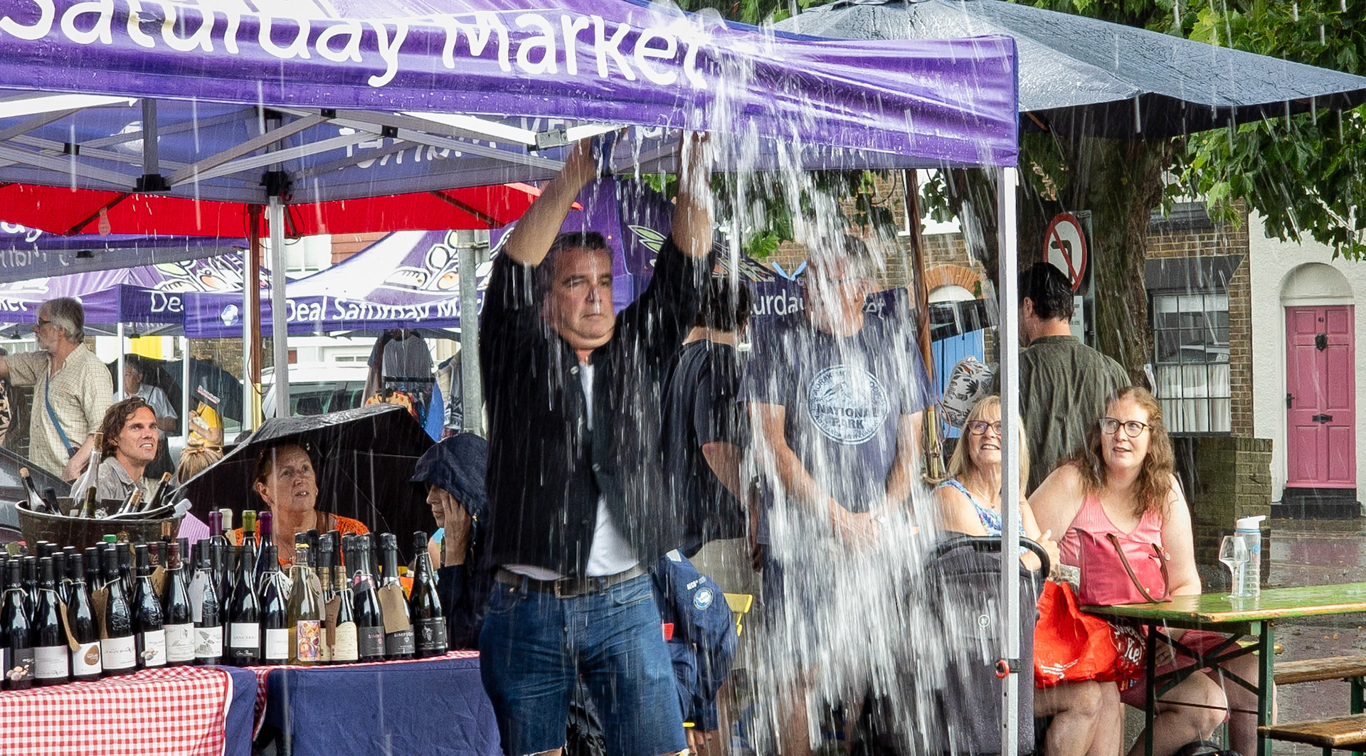 Pascal's wine stall in the typhoon yesterday. Market Day, Saturday, 1st August, 2026.