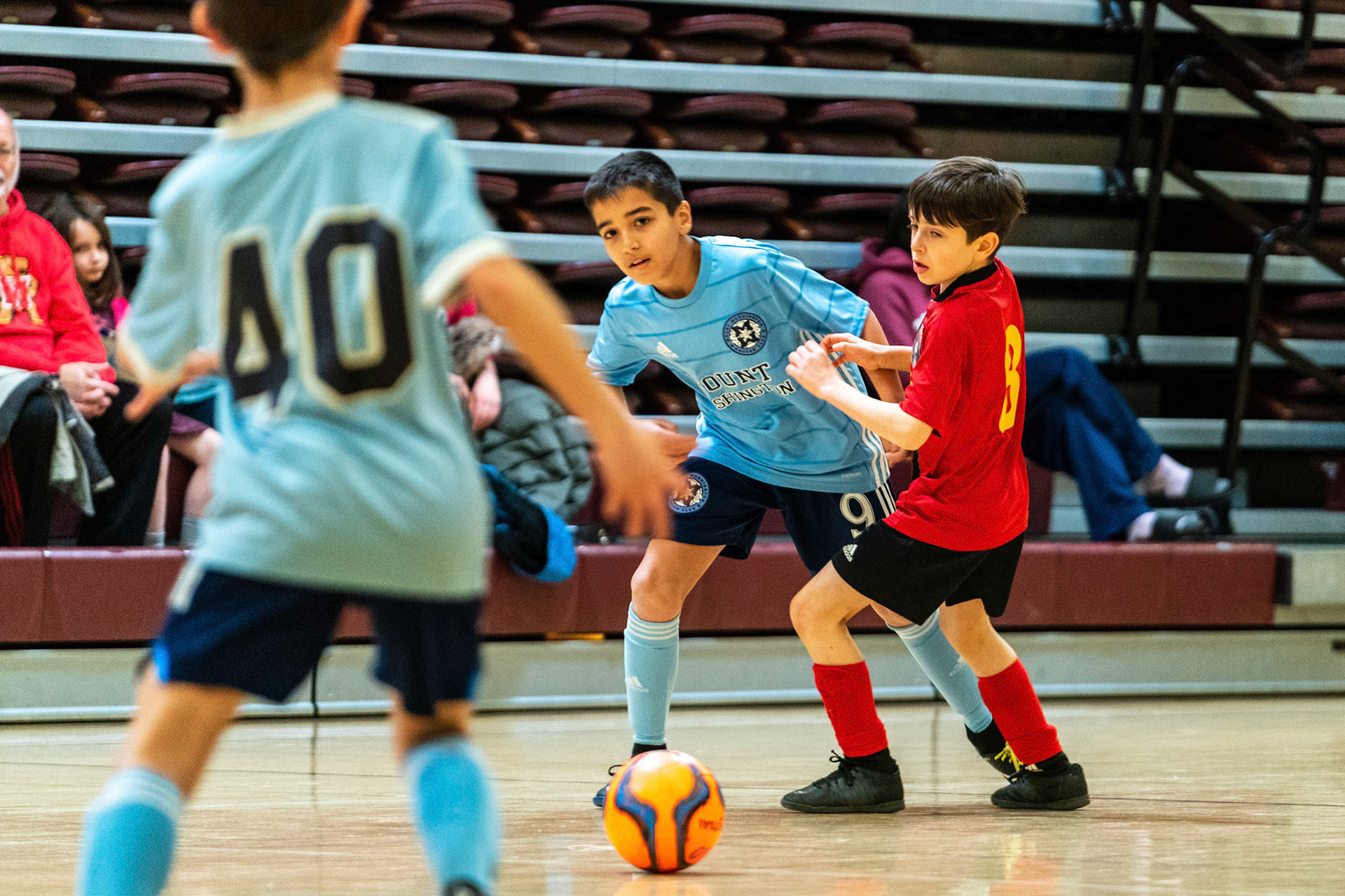Caleb crosses the ball to Jonah as Mt Washington defeats Charles Village Black 11-3 on Saturday, February 18, 2023.