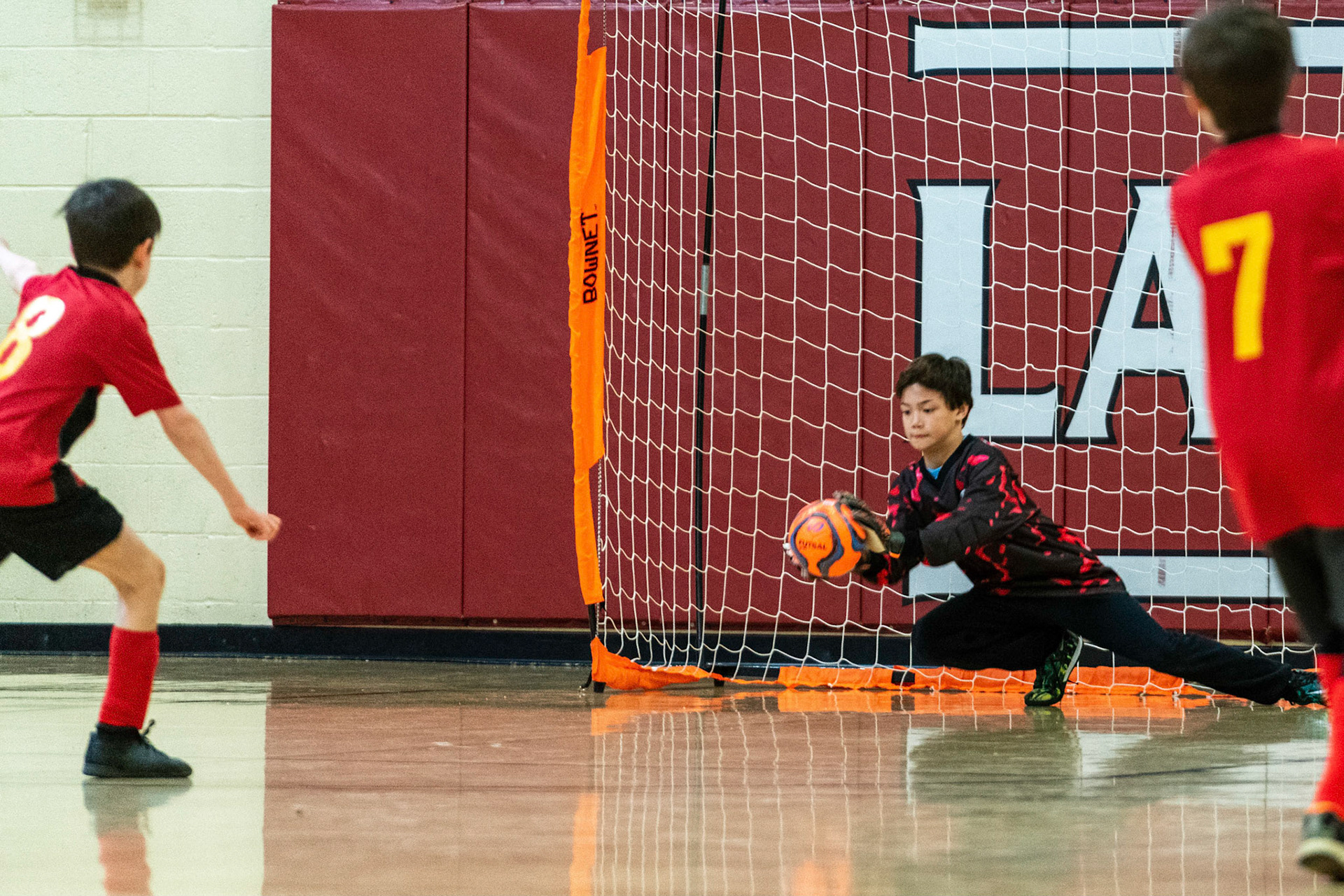 Luke makes a diving save as Mt Washington defeats Charles Village Black 11-3 on Saturday, February 18, 2023.