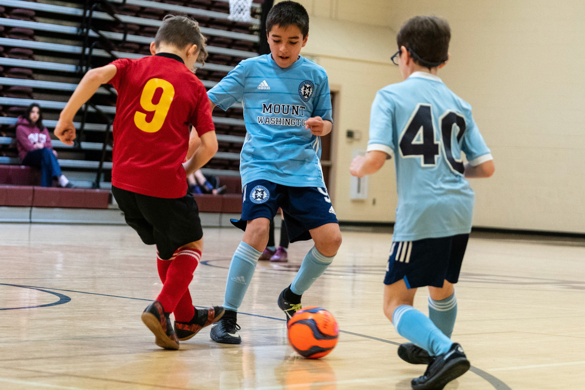 Caleb passes the ball to Jonah as Mt Washington defeats Charles Village Black 11-3 on Saturday, February 18, 2023.