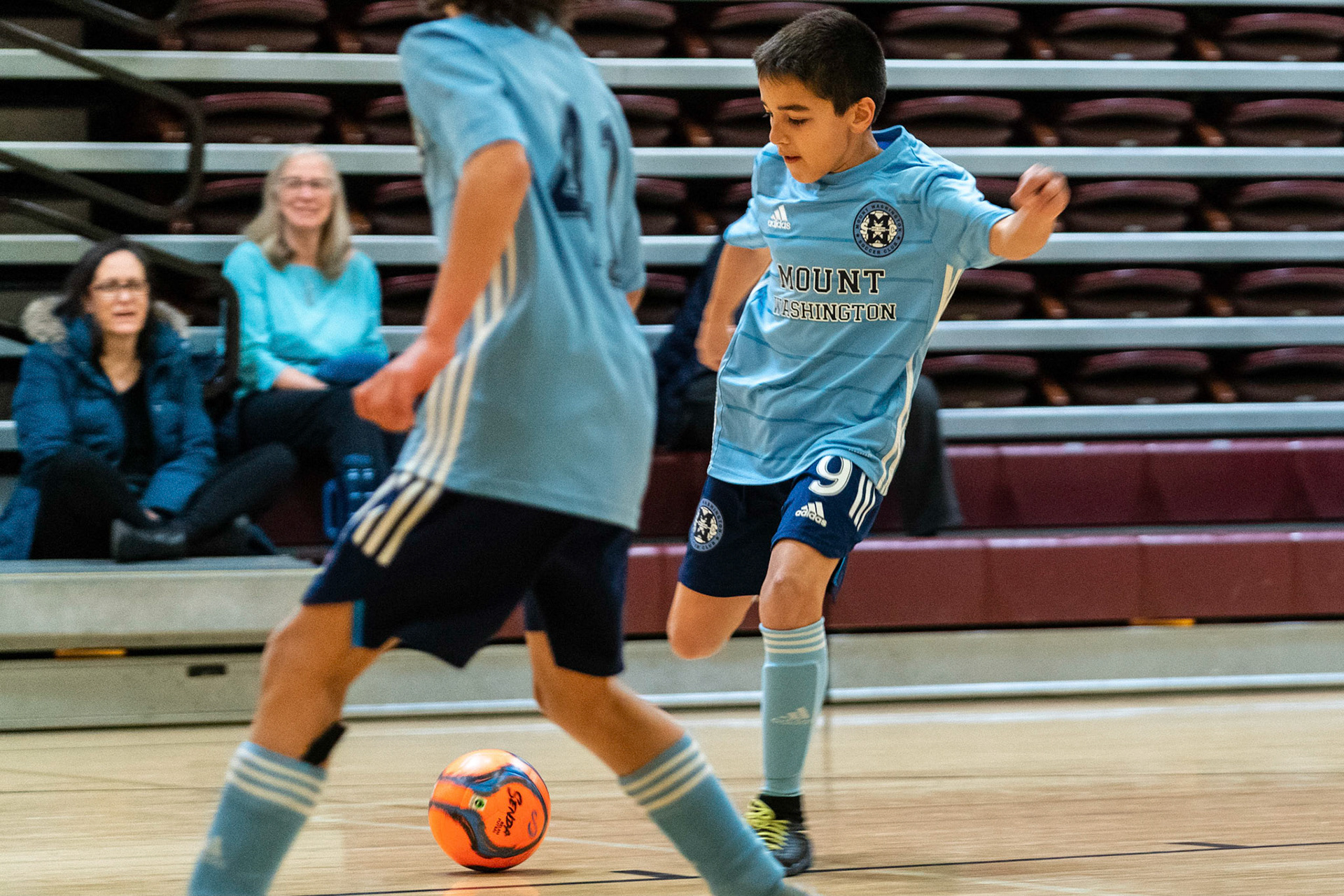 Caleb takes a shot on goal as Anderson waits back post as Mt Washington defeats Charles Village Black 11-3 on Saturday, February 18, 2023.