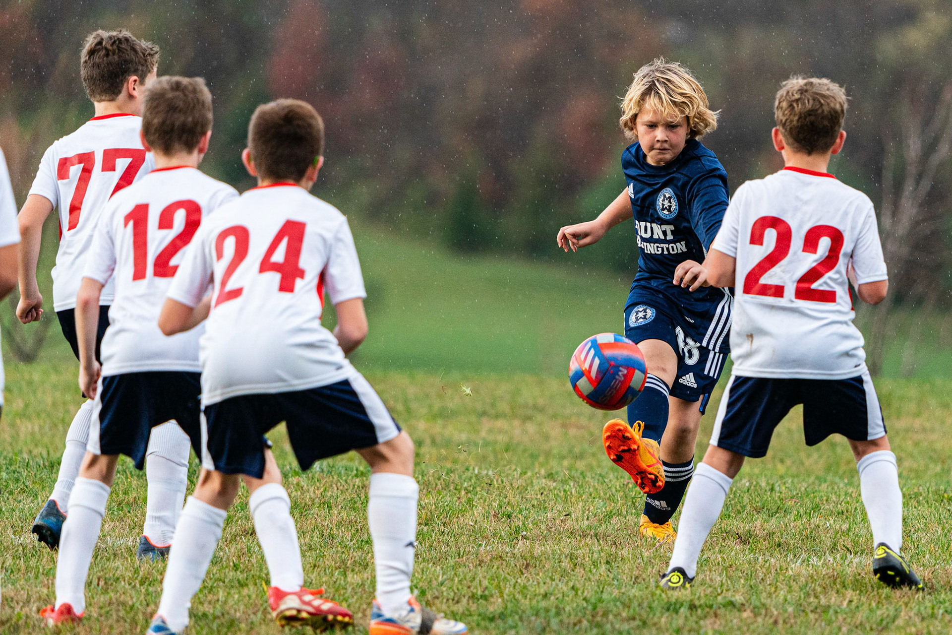 Reed, facing five Freedom players, send the ball out of danger as Mt. Washington defeats Freedom SC 2-1 in their final game of fall 2022.