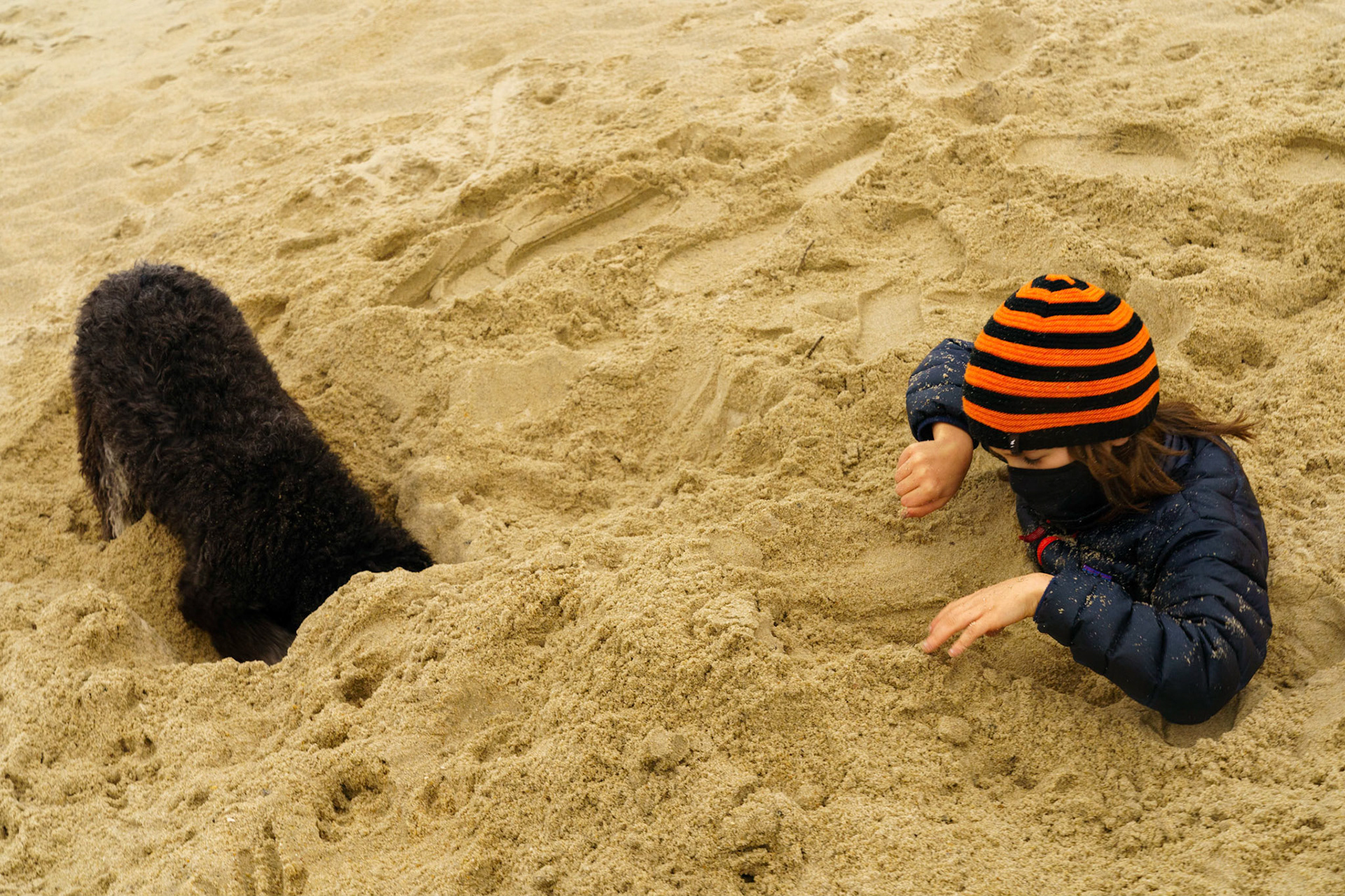 New Year’s trip to the beach. Playing at the beach. Buried little ones.