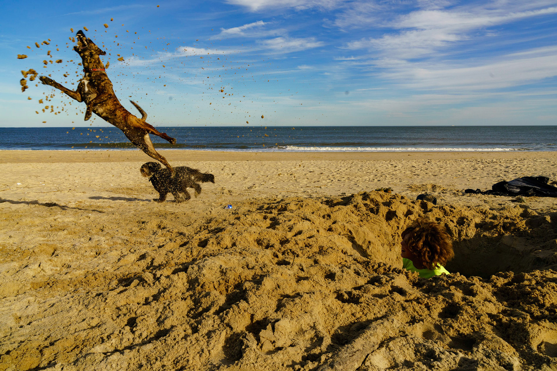 New Year’s trip to the beach. Playing at the beach. Buried little ones.