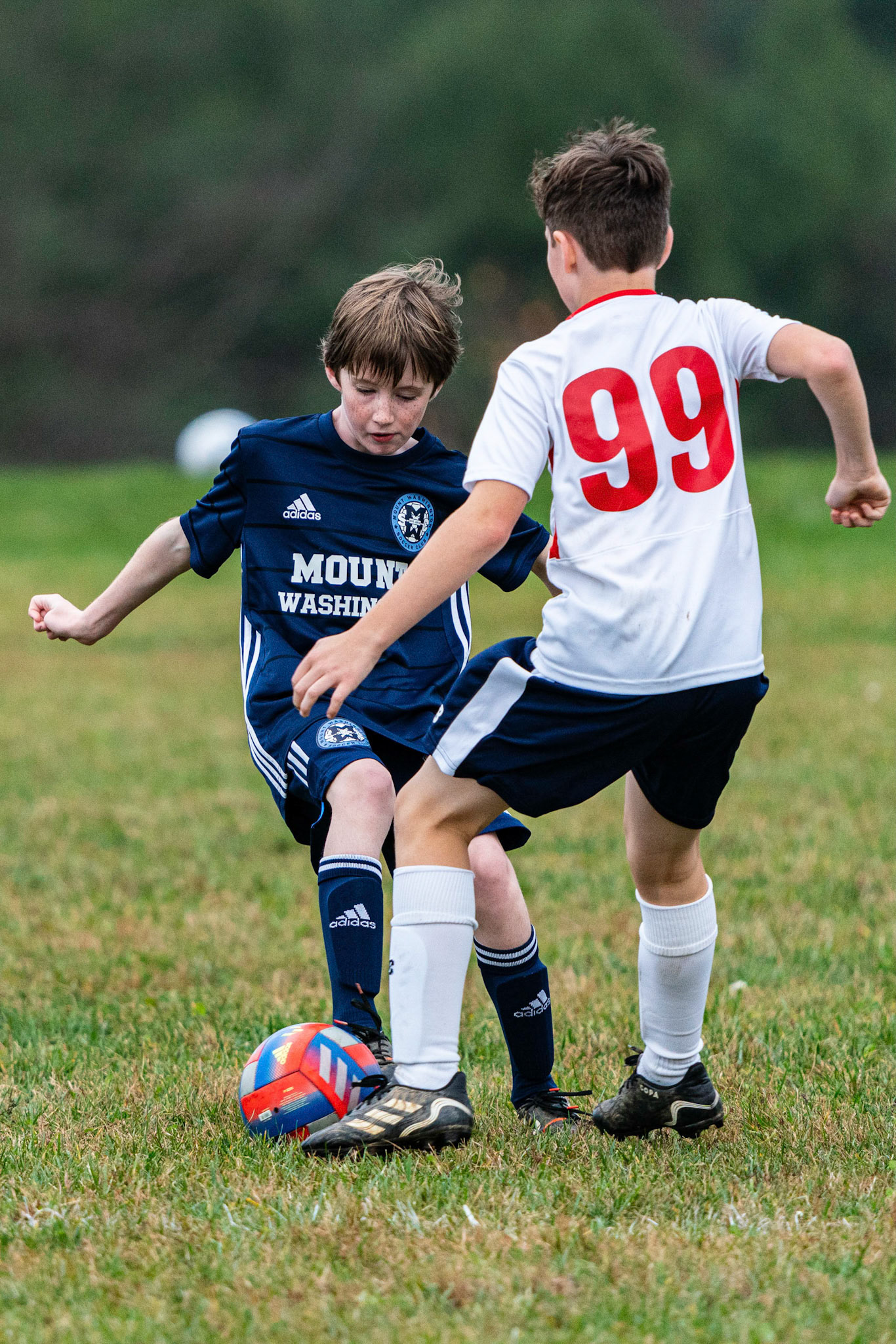 Liam moves the ball to the outside of the Freedom player as Mt. Washington defeats Freedom SC 2-1 in their final game of fall 2022.