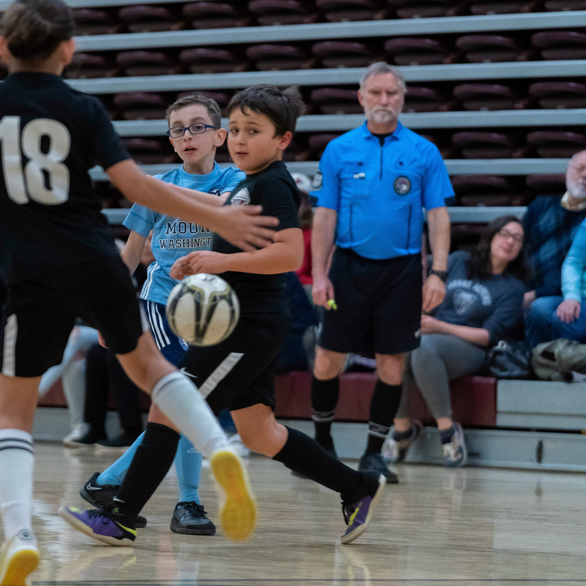 Jonah’s shot slips between two defenders in the second half of the Mt. Washington Soccer 22/23 12-5 victory over  Towson United. Each player scored.