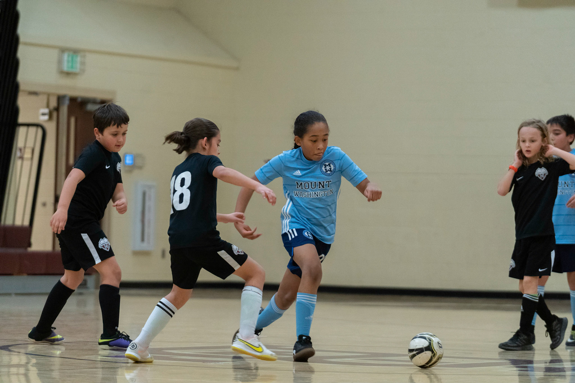 Drake evades the defense in the first half of the Mt. Washington Soccer 22/23 12-5 victory over  Towson United. Each player scored.